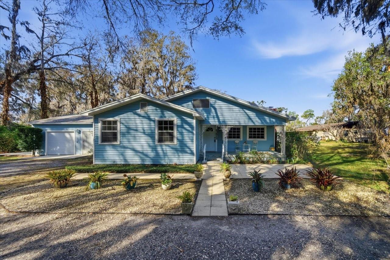 Welcome to this charming lakefront cottage on the peaceful shores of Lake Hobbs, a private 60-acre lake offering serenity, space, and endless possibilities. With 85 feet of waterfront and nearly an acre of land, this property is a rare opportunity to enjoy true lakeside living. This cozy 3-bedroom, 1-bath home is filled with character and warmth. The inviting living room features a charming fireplace flanked by built-in cabinetry — the perfect space to gather after a day on the water. The kitchen offers Corian countertops and an abundance of cabinet space, blending functionality with classic cottage charm. A separate dining room with additional built-ins adds both storage and timeless appeal. The spacious primary bedroom includes built-in closets, while two additional bedrooms provide flexibility for guests, a home office, or creative space. Outside, the expansive lot offers additional parking, ample storage, and a detached two-car garage — ideal for lake toys, hobbies, or workshop space. With nearly an acre to work with, there is plenty of room to expand, enhance, or simply enjoy the privacy and open space. Whether you’re looking for a weekend retreat, full-time lakefront living, or a property with future potential, this Lake Hobbs gem offers the perfect blend of charm, land, and waterfront lifestyle.