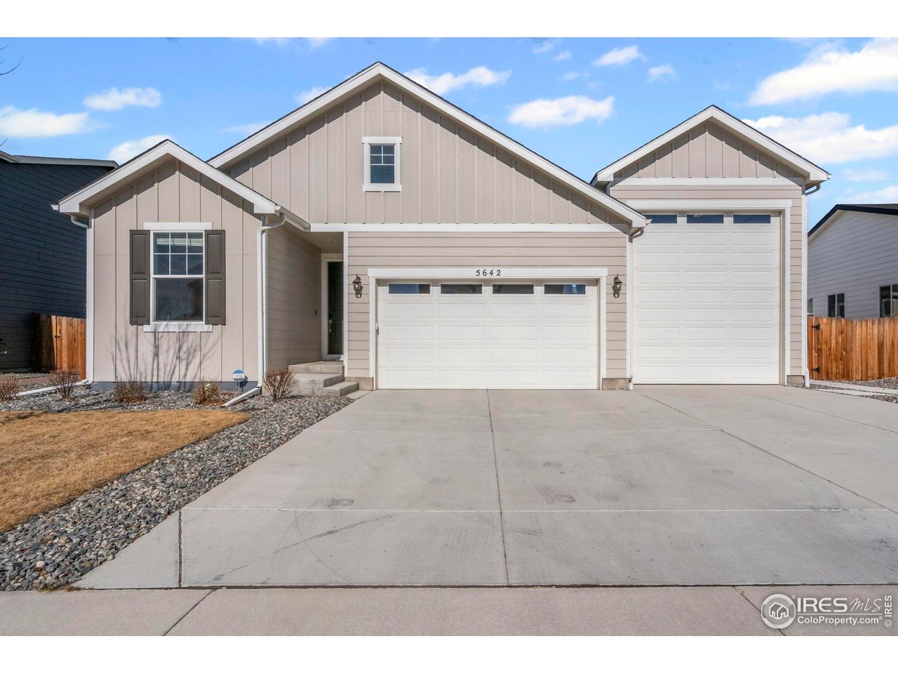 Desirable ranch-style home offering single level living with open floor plan, smartly designed living spaces, and amazing RV garage. Luxury vinyl plank throughout main living area, additional canned lighting in kitchen and great room, extra window added in great room for more natural light and ceiling fans are just some of the upgraded features. Kitchen offers abundant cabinetry with soft close doors and drawers, pantry, quartz counter tops, single basin composite sink, GE Profile stainless appliances including refrigerator and upgraded gas range/oven that has an air fryer option! Relax by the modern horizontal fireplace with herringbone patterned tile in the large great room. Oversized sliding glass doors open out onto a spacious covered patio that runs the length of the back of the house. Gas line on the patio and additional railing make this a cool and cozy space for summer barbecues. Easy maintenance back yard with all weather turf keeps mud and mess at bay during summer rain and winter snow. Split bedroom plan with 3rd bedroom currently being used as an office with French doors and primary suite at the back of the home. Spa-like oversized primary shower with tile base and frameless shower door plus walk-in closet with generous storage are sure to please. RV garage is true to it's name with a 14' garage door and 45' long bay plus a garage heater, epoxy flooring, 50 amp hookup and hose spigot. Active radon system, Ring door bell, Yale front door lock and one year home warranty all add to the value of this impeccably kept home.