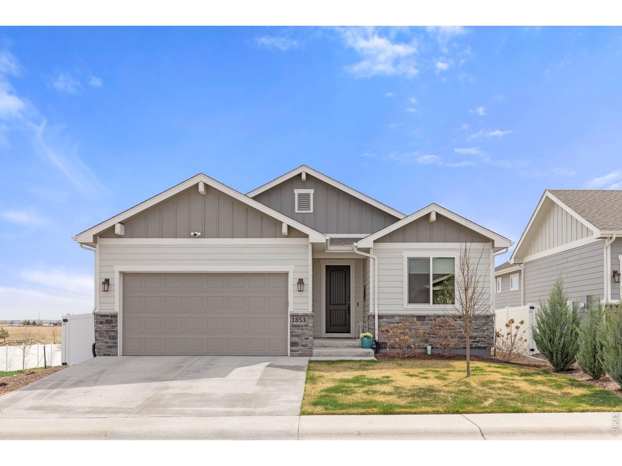 This beautifully built Bridgewater walkout ranch home in The Ridge at Harmony is move in ready! The lot faces south for unobstructed views of the mountains with a fully fenced and landscaped yard. Enjoy the beautiful sunsets while dining on the walkout patio off the dining/living area. Amazing upgrades have been done throughout the home like oak wood floors on the main floor. Tharp hickory cabinets in kitchen. Gourmet kitchen with quartz slab countertops and large island perfect for entertaining. Gas range/hood plus double ovens, refrigerator, dishwasher all in stainless steel making it a chef's dream kitchen. And don't forget the large walk-in pantry! Upstairs has a spacious master suite with a luxury 5 piece bathroom and walk-in closet. Located on first floor is another bedroom and/or office, and full bathroom. Hunter Douglas blinds with top down bottom up throughout the home. Laundry is on the first floor with an additional sink. There is also a sink in the garage for easy clean up! Downstairs is light and bright with 2 more bedrooms plus a large gathering space and bar area. Sliding glass doors for convenient access to the backyard. There is also a large storage area downstairs for all your extra stuff! Home has a humidifier, tankless water heater, and A/C.