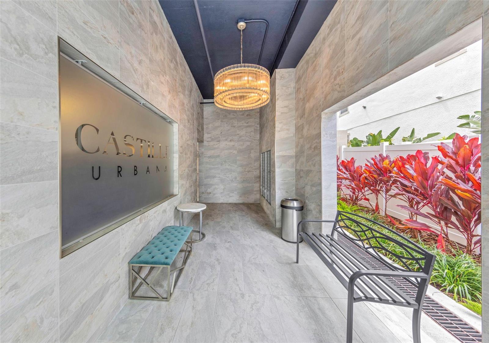 Amazing Price Improvement!  Welcome to refined urban living at Castille Urbana, a boutique 40-residence, pet-friendly community offers one of the lowest HOA fees among newer construction and an unbeatable walkable location including Tropicana Field. Residence 305 (Gardena floor plan) features a spacious 3BD/3BA split layout with open-concept living, 9’ ceilings, and expansive hurricane-impact windows that fill the home with natural light.This upgraded CORNER unit goes beyond builder-grade finishes with over $20K in custom electric blinds/shades, a custom built-in entertainment center with 75” TV, plus engineered hardwood flooring, custom lighting and ceiling fans, Electrolux washer/dryer and even a reverse osmosis system.The Stunning kitchen includes Bosch stainless steel appliances, quartz countertops, solid wood soft-close cabinetry, marble backsplash, and designer pendant lighting.Spacious bedrooms offer ensuite baths with quartz counters, dual vanities, and Carrara-style tile and huge walk-in closets for all three rooms.Enjoy city views from your private balcony and amenities including fitness center, club room, outdoor patio, dog park/wash station, gated garage parking, and bike storage.So close to dining, coffee shops, waterfront parks, attractions, this home is Ideal as a primary residence or city retreat. Minutes from Tropicana Field, Al Lang Stadium, USF and Albert Whitted Airport, this location puts you at the heart of downtown—perfect for enjoying St. Pete’s vibrant, walkable lifestyle.