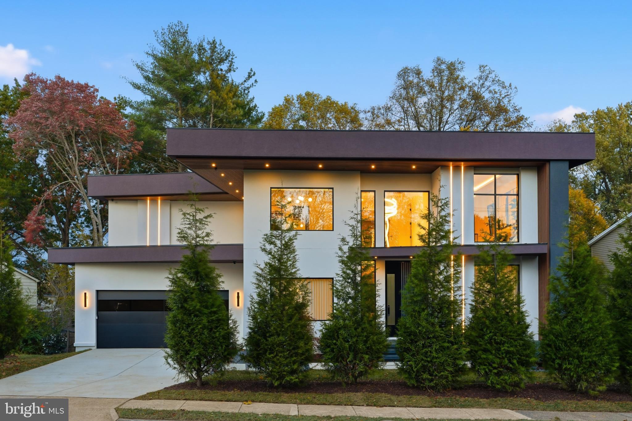 Welcome to Nirvana House – The Pinnacle of Modern Luxury Living! Located in the heart of Vienna, Virginia, Nirvana House is a modern architectural masterpiece that redefines the meaning of contemporary luxury. Set on a lush 16,417 SF lot, this residence spans over 7,972± square feet of inspired design, blending refined elegance, cutting-edge technology, and everyday functionality.Just minutes from Tysons Corner, this exceptional home offers the perfect balance between urban sophistication and suburban tranquility.Main Level – Seamless Living & EntertainingSpanning 2,530± square feet, the main level welcomes you through a 10-foot pivot glass door into a two-story foyer framed by steel-and-glass floating stairs and floor-to-ceiling European windows that fill the home with natural light.Designed for effortless flow, the main level features a private home office, formal living and dining rooms, a breakfast nook, and a stunning modern kitchen with European cabinetry, an oversized island, and sleek finishes. A spice kitchen, walk-in pantry, custom-built mudroom, and dedicated pet shower elevate convenience to luxury.A 17-foot sliding glass wall opens to a covered terrace featuring porcelain tile flooring, a fireplace, integrated speakers, wood ceiling, and glass railings with steps leading to the backyard — creating a seamless indoor-outdoor living experience. 10 feet main level ceiling height, emphasizing openness and grandeur.Upper Level – Private SerenityThe upper level, offering 2,912± square feet, is a sanctuary of privacy and comfort. It features four ensuite bedrooms, each with custom walk-in closets and spa-inspired bathrooms.The owner’s suite is a true retreat, showcasing dual European walk-in closets, a luxurious spa like bath with heated floors, floating dual vanities, custom lighting, a smart water closet, rain shower, and a sculptural freestanding tub. Step outside to the private covered balcony finished with porcelain tile and glass railings, ideal for tranquil mornings or nights.Upper Level Additional highlights include 10-foot ceilings, an elevator shaft, and a designer laundry suite with an elevated washer and dryer — the kind of detail you’d expect to find only in a magazine.Lower Level – Wellness & EntertainmentThe lower level, spanning 2,530± square feet, is the ultimate leisure and wellness haven. Featuring 9-foot ceilings and abundant natural light, this fully walk-out level includes a recreation lounge, custom wet bar, wine display wall, fitness room, steam shower, dry sauna, and a powder room. An additional bedroom with ensuite full bath and walk-in closet offers perfect guest accommodations. A covered patio extends the entertainment space outdoors.Every inch of Nirvana House speaks to excellence in craftsmanship and design. The exterior is finished with smooth stucco exteriors, architectural accents, and exterior LED lighting that defines its striking silhouette.Inside, 10-inch European white oak engineered flooring flows throughout upper 2 levels, complemented by custom built-ins, European cabinetry, and modern gas fireplaces that bring warmth and elegance to key living spaces.Nirvana House is also a has smart home features, allowing you to control lighting, sound, cameras, and more at the touch of a button — luxury and convenience intertwined.Prime LocationPerfectly positioned for both work and play, Nirvana House sits just: 1.5 miles from Tysons Corner, 20 minutes to Washington, D.C., 14 miles to Reagan National Airport, 14 miles to Dulles International Airport, 10 miles to River Bend Golf & Country ClubArchitecturally, Nirvana House is more than a residence — it’s an experience. A place where design meets serenity, innovation meets comfort, and every detail reflects a new standard of living.Step into the future of modern luxury. Step into Nirvana House. Additional homesites available upon request.