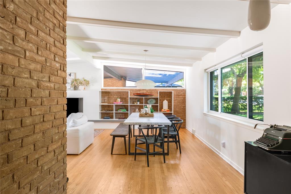 Experience the charm everyone loves of mid-century modern living in this authentic 1950s home, ideally located just minutes from the shores of White Rock Lake. Filled with character and original details, this residence offers both timeless appeal and everyday comfort.

Inside, you’ll find original hardwood floors, classic brickwork, and period pavers at the entry that highlight the craftsmanship of the era. Large windows in every room and angle bring in abundant natural light, creating a warm and inviting atmosphere throughout. The primary bedroom features an ensuite back and sliding glass doors to the outdoor space.

Step outside to an oversized backyard oasis, complete with mature bamboo for added privacy, custom pavers, and a unique conversation pit—perfect for entertaining or relaxing under the stars. The combination of original design and thoughtfully preserved outdoor spaces makes this home truly one-of-a-kind.

The two-car carport pays homage to the signature style of mid-century design while offering practical functionality, including an enclosed storage space you can lock for added convenience.

With its prime East Dallas location and close proximity to White Rock Lake’s trails, parks, and recreation, this mid-century gem offers a lifestyle that’s as vibrant as it is serene. OPEN HOUSE SATURDAY from 1-3PM!
