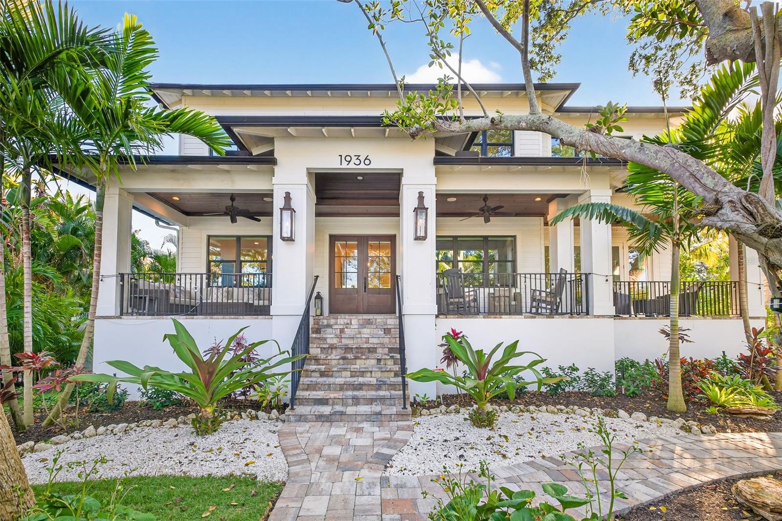 An Exquisite Waterfront Sanctuary of Rare Distinction: A singular waterfront estate spans two combined lots on Coffee Pot Blvd, St. Petersburg's most exclusive enclave of waterfront living. This residence is being sold with two deeded deep water/dock lots, this remarkable property delivers the ultimate expression of refined coastal living. One full waterfront lot has been artfully transformed into a lush, private Secret Garden, creating a resort-style retreat unlike anything else on the market. Architectural elegance unfolds against a backdrop of mature landscaping and open water vistas with direct access to Tampa Bay, and no bridges, making this a dream setting for serious boating enthusiasts. Here, serene outdoor living and sophisticated interiors exist in perfect harmony. Constructed of solid concrete block and thoughtfully designed across more than 5,071 square feet, the residence blends modern luxury with timeless grandeur. Five generously scaled bedrooms each feature ensuite baths, complemented by an additional designer half bath conveniently positioned to serve guests and the pool. Notably, the home offers a primary suite on each level, both capturing sweeping views of Coffee Pot Bayou—an exceptional arrangement that elevates daily living. A stately waterfront office anchors the main floor, while the upstairs primary retreat is enhanced by two expansive dressing rooms, along with an additional bonus office or flex space complete with a wet bar and refrigerator overlooking the water. The open concept living spaces are ideal for both grand entertaining and intimate gatherings. A formal dining room with panoramic Bayou views flows seamlessly into an expansive family room and a chef’s kitchen of uncompromising quality. Wolf and Sub-Zero appliances, quartz countertops, bespoke cabinetry, a substantial center island, dual ovens, two dishwashers, twin walk-in pantries, and a fully appointed butler’s pantry with beverage center, ice maker, and wet bar complete the space. A climate-controlled wine cellar nearby adds a final note of quiet indulgence. Beyond the interiors lies the home’s most enchanting feature: a hidden outdoor oasis. Covered patios, a welcoming front porch, and a tranquil lanai frame a saltwater pool and spa. Beyond, concealed by lush greenery, the Secret Garden reveals itself; an extraordinary sanctuary ideal for peaceful afternoons, elegant soirées, or unforgettable charity gatherings beneath the stars. Additional highlights include a rear-facing two-car garage designed to accommodate a lift, an elevator servicing every level, soaring 10-foot ceilings, custom millwork throughout, a whole home generator, and impact-resistant windows and doors for effortless peace of mind. Perfectly positioned moments from downtown St. Petersburg, the Pier, museums, waterfront parks, and scenic Coffee Pot Bayou, where dolphins and manatees are frequent visitors, this residence offers a lifestyle of effortless luxury. Golf cart to dinner, stroll the water’s edge, or depart for a weekend escape via nearby Albert Whitted Airport. Every element has been carefully curated. Rare, refined, and truly unforgettable, this waterfront masterpiece must be experienced to be fully appreciated.