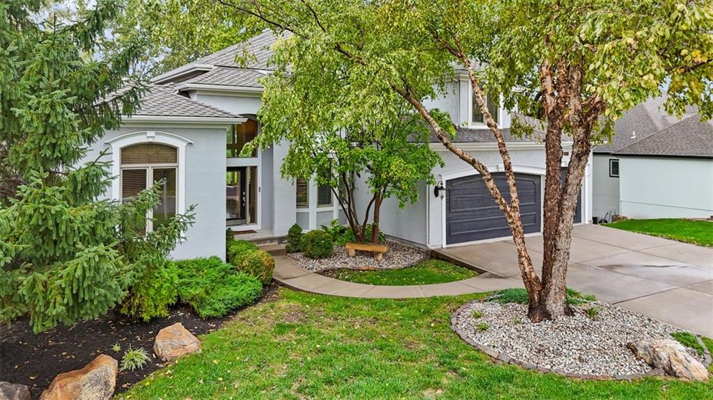 Situated directly on the 9th hole of Falcon Valley Golf Course, this meticulously maintained 1.5-story residence offers over 6,300 square feet of thoughtfully designed living space with sweeping golf course & lake views. The open-concept main level features a grand hearth room with fireplace & custom built-ins, formal dining, private office with built-ins, & a well-appointed chef's kitchen complete with granite countertops, stainless steel appliances, under- & over-cabinet lighting, oversized center island, & walk-in pantry. Hardwood flooring extends throughout the primary living areas, while expansive windows with plantation shutters showcase the surrounding fairways & water views. The spacious primary suite offers a sitting area, vaulted ceiling, floor-to-ceiling windows, oversized walk-in closet, jetted tub, dual vanities, & a large tiled walk-in shower. Generously sized secondary bedrooms provide exceptional space throughout the home. The finished walkout lower level offers over 2,200 square feet of additional living & entertaining space, featuring a dramatic two-tier design, full bar area, & direct access to a covered patio. Outdoor living continues on the expansive deck overlooking the golf course, lakes, & professionally maintained landscaping. An exceptional opportunity to enjoy golf course living within the highly sought-after Falcon Valley community.
