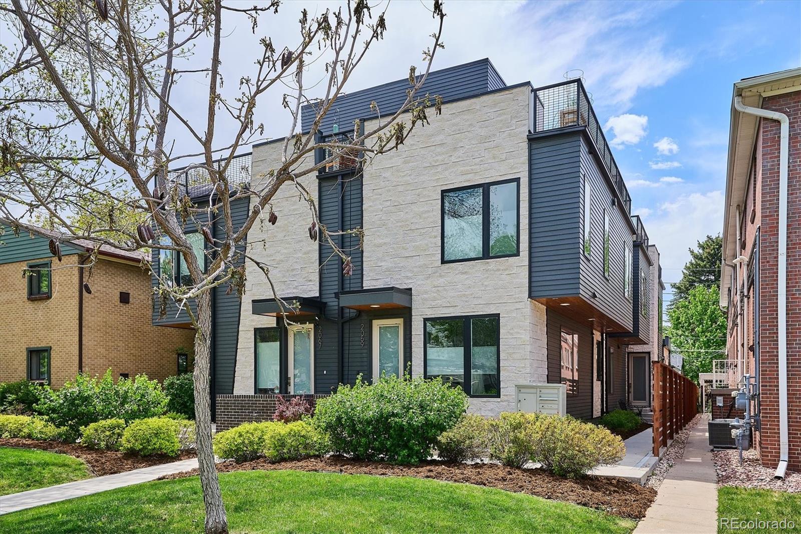 Located in the highly sought-after Observatory Park neighborhood — just a short walk to the University of Denver — this beautifully maintained townhome offers an ideal opportunity for parents and investors seeking a high-quality, low-maintenance home for DU students or for the Buyer looking for a low maintenance walkable home. The modern, flexible layout features dual primary suites, one on the main level and one upstairs, creating true separation and privacy for roommates or visiting family. Designed with elevated finishes by Neo Designs, the main level showcases wide-plank laminate flooring, upgraded iron railings, and a bright, open living space. The chef-inspired kitchen includes an oversized eat-up island, quartz countertops, glass tile backsplash, stainless steel Samsung appliances, gas range/oven, and Eurocase custom cabinetry — a perfect blend of durability and style for everyday student living.  Thoughtful upgrades continue throughout the home with pendant lighting, recessed lighting, and under-cabinet illumination. A dedicated dining area, main-level laundry, and a utility closet with generous storage make the space exceptionally functional.  Upstairs, the second primary suite offers a walk-in closet, dual vanities, and a luxurious oversized shower with upgraded tile and a frameless glass enclosure. The top-floor loft provides an additional retreat or study space, complete with a wet bar — ideal for quiet evenings or hosting friends. The rooftop deck is a standout feature, perfectly positioned to enjoy Colorado’s sunsets and star-filled skies.  With unbeatable access to Observatory Park, DU, shopping, dining, and bike-friendly routes, this location is a dream for students and a smart investment for long-term rental demand. Home can be sold with or without furnishings, making move-in effortless.  Don’t wait — opportunities like this near DU are rare.