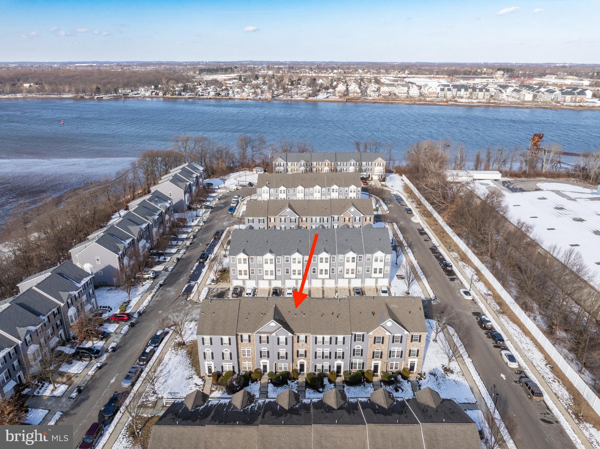 Don't Miss This Amazing Opportunity To Be By The River With A Maintenance Free Lifestyle You Deserve! Welcome To 6 Fawn Court, A  Beautiful 3 Bed, 2.5 Bath Townhome In Rivers Edge With Over 2,100 Sq Ft Of Living Space! This Rare Inglewood Model By Ryan Homes Features Soaring 9 Foot Ceilings Throughout, Making This Already Large Home Feel Even Warmer And More Inviting, While Gleaming Hardwood Floors Run Throughout The First And Second Floors.  The First Floor Features A Cozy Living Space Perfect For A Private Home Office Situated Behind Double Glass French Doors. Step Up To The Main Floor And Prepared To Be Wowed By The Stunning Family Room And Kitchen With A Beautiful Open Layout.  This Chef's Kitchen Is The Perfect Spot For Entertaining Featuring A Huge Center Island With Sink, Convenient Double Oven, Newer Stainless Steel Appliances, An Abundance Of Rich Dark Cherry Cabinets,  Gorgeous Pendant Lighting, Stylish Tile Backsplash, Dining Table Space, Gleaming Granite Counters, And Large Pantry. The Windows Are Adorned With Dramatic Treatments And Allow For Plenty Of Bright, Natural Light. The Kitchen Flows Right Into The Massive Family Room Featuring A Cozy Gas Fireplace, Gleaming Hardwood Floors, And More Natural Light From An Abundance Of Windows. A Half Bath Completes This Level. Upstairs, You Will Find The Beautiful Primary Bedroom With Tray Ceiling, Large Walk In Closet, Electric Fireplace, And An Ensuite Bath Complete With  Dual Sinks, Tile Lined Shower, And A Jetted Tub To Unwind In At The End Of A Long Day. Down The Hall Are Two Additional Generously Sized Bedrooms And A Full Bath.  Other Highlights Include Plenty Of Storage Space,  Newer Hot Water Heater (2023), Newer Washer/Dryer (2021), Plus New Roof Coming Soon (Included In HOA) In 2026. Hurry, This One Won't Last!