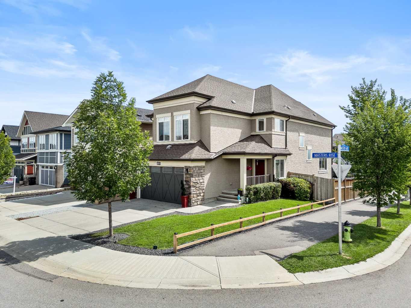 Welcome to 103 Masters Ridge SE, a beautifully upgraded home located in the award-winning lake community of Mahogany. Perfectly positioned on a quiet street DIRECTLY ACROSS THE STREET FROM A FAMILY FRIENDLY PARK, this property combines thoughtful design, stylish finishes, and access to one of Calgary’s most desirable lake communities. 

Step inside and you are greeted by a bright and inviting open-concept layout. The spacious foyer opens into the main living area, where large windows allow natural light to flow throughout. The GOURMET UPGRADED KITCHEN WITH A BUTLERS PANTRY is a true showpiece, featuring quartz countertops, gas range, an oversized island with seating, stainless steel appliances and modern cabinetry with ample storage. The kitchen flows seamlessly into the dining area and living room, creating a perfect space for entertaining. A cozy fireplace anchors the living room, while upgraded lighting and designer details add a touch of sophistication.

Upstairs, you’ll find three spacious bedrooms, including a luxurious primary suite designed for relaxation. The ensuite bathroom is equipped with dual vanities, a glass-enclosed shower, and a generous walk-in closet, offering comfort and convenience. The upper level also includes a versatile bonus room, ideal for a home theatre, kids’ play area, or quiet retreat, along with a full bathroom and convenient upper-floor laundry.

The fully finished basement expands your living space with a large recreation room perfect for family movie nights, game space, or a home gym. Two additional bedrooms with walk-in closets and a full bathroom make this lower level ideal for teenagers, extended family, or guests.

This home comes complete with numerous upgrades, including CENTRAL AIR CONDITIONING, SMART THERMOSTAT, WATER SOFTENER, HUMIDIFIER, CAT-6 ETHERNET WIRING, AND A FINISHED GARAGE. The corner lot allows for extra natural light and a more private outdoor setting.

Enjoy sunny afternoons in the landscaped backyard with a back lane making access to the backyard seamless or take advantage of the unparalleled amenities Mahogany has to offer. As a resident, you’ll have year-round access to Mahogany Lake, with sandy beaches, boating, skating, and a community centre. Walking paths, playgrounds, schools, and shopping are all within minutes, while Seton’s South Health Campus and Calgary’s ring road provide convenient access for commuting and amenities.

With its thoughtful floor plan, modern upgrades, and a location in one of Calgary’s most celebrated communities, 103 Masters Ridge SE is the perfect place to call home. Don’t miss the opportunity to make it yours—book your private showing today!