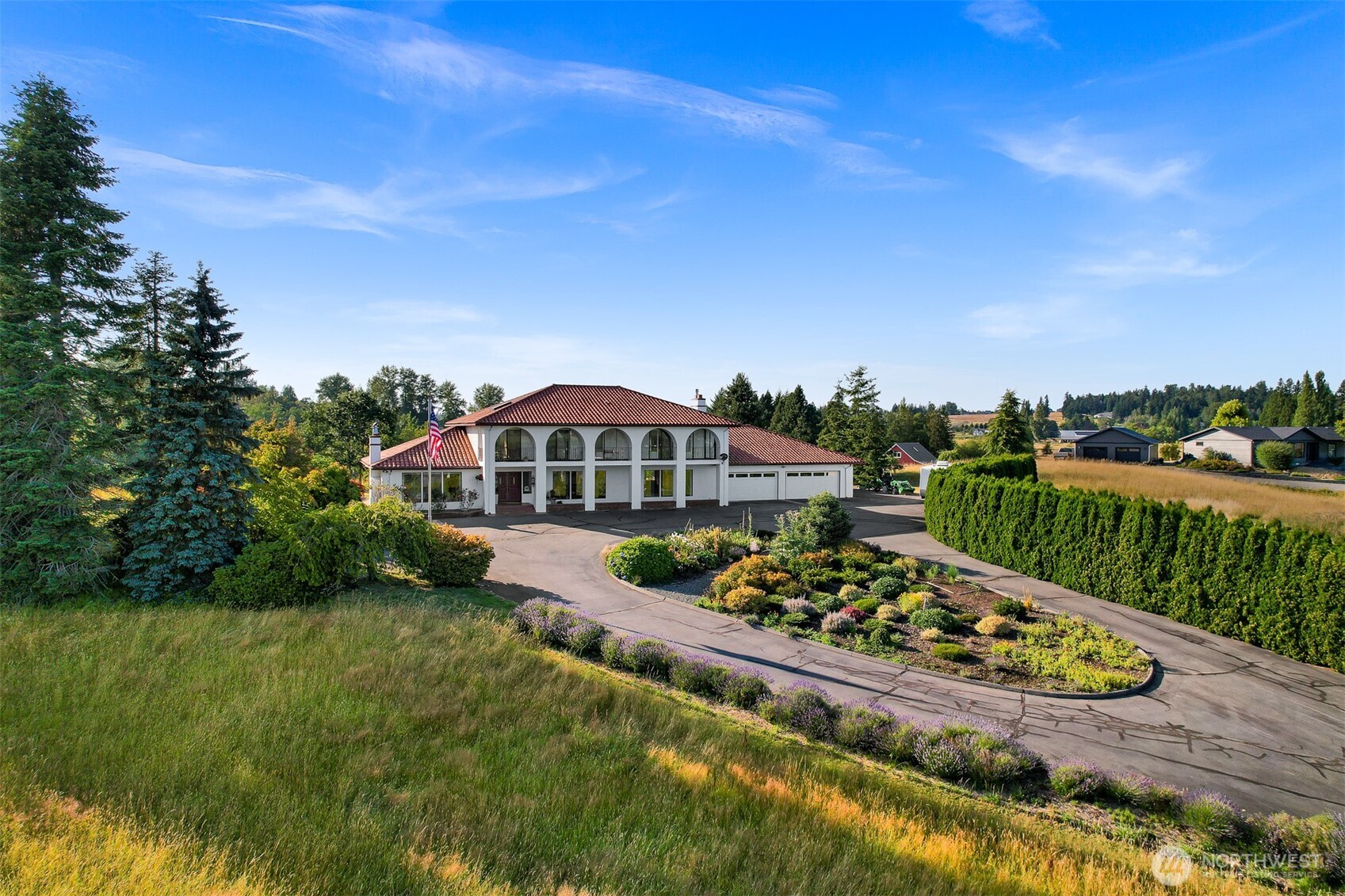Marketing Remarks  Perched atop 5 private acres, this breathtaking estate offers some of the most spectacular Mt. Baker views you'll find anywhere. With 4,224 square feet of thoughtfully designed living space, this exceptional home features 5 bedrooms, a formal dining room, two spacious living areas, and an incredible sunroom where panoramic mountain views steal the show. Mt. Baker can be enjoyed from many rooms throughout the home, creating a stunning backdrop year-round. The expansive primary suite is a true retreat with its own fireplace and beautifully updated bathroom featuring a large walk-in tile shower. Convenience abounds with laundry rooms on both levels, while outside you'll find a huge covered patio overlooking the level backyard, mature fruit trees, and a charming older barn tucked into the corner of the property. The acreage offers plenty of space to add a dream shop if desired, along with a massive 1,280-square-foot garage, abundant parking, and dedicated RV parking. Offering incredible privacy, unforgettable views, and endless possibilities, this is truly a one-of-a-kind property that must be experienced in person.