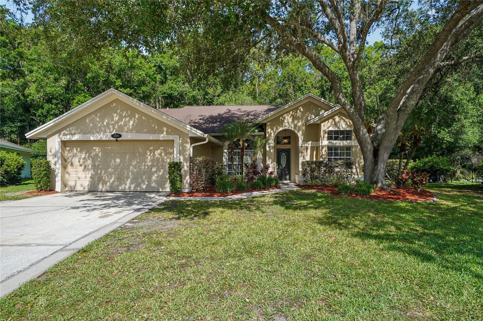 Screened Pool Home on Preserve lot • Fire Pit Patio • Approx. 3.7 mi to Richard Ervin Park & Lake TarponSet on a private preserve-backed lot on a quiet cul-de-sac in Tarpon Springs, this single-story concrete block stucco home offers a split-bedroom layout and two distinct outdoor living zones: a screened enclosure with heated saltwater pool and paver deck added in 2022, and an open-air paver patio with fire pit just beyond the screened patio overlooking the fenced yard and preserve. Two storage sheds convey.The open-concept living and dining areas connect directly to the lanai, with sliding glass doors off the primary bedroom opening to the pool. LVP flooring runs throughout the main living areas. The kitchen was updated after 2018 with white shaker cabinets, granite countertops, and a mosaic tile backsplash. Stainless steel appliances include a double-oven range. A breakfast bar and eat-in dining nook add casual dining options, and a separate formal dining room provides additional space.The primary suite includes direct lanai and pool access via sliding glass door, a dual-sink vanity, soaking tub, and walk-in shower. Two additional bedrooms are positioned on the opposite side of the split floor plan. The stained glass front door, crystal light fixtures, and recessed lighting carry through from the post-2018 updates. No flooding issues during recent storms. Property holds a Letter of Map Amendment (LOMA) for elevation.3 bedrooms | 2 bathrooms | 2-car garage | 1,585 sq ft | Built 1990 | HOA $120/quarterNearby: Approx. 3.7 mi to Richard Ervin Park and Lake Tarpon (picnic areas, lake views). Approx. 0.4 mi to Brooker Creek Elementary School. Approx. 6.2 mi to A.L. Anderson Park (dog park, boat launch, Lake Tarpon shoreline, hiking trails). Approx. 3.1 mi to Brooker Creek Preserve (8,700-acre nature preserve, 6.2 mi of hiking and equestrian trails, free admission, Environmental Education Center). Approx. 6.8 mi to Tarpon Springs Historic Sponge Docks (waterfront dining, Greek restaurants, boutique shopping). Approx. 5.7 mi to Urban Grounds coffee. Approx. 6.3 mi to Tarpon Social Club coffee. Approx. 6.5 mi to Larry's Grillhouse. Approx. 6.8 mi to Rusty Bellies Waterfront Grill. Approx. 3.5 mi to Publix. Approx. 5.5 mi to John Chesnut Sr. Park (Lake Tarpon boat ramp, nature trails, playground, dog park). Easy access to East Lake Road corridor and US-19.Includes 3D tour and floor plan.