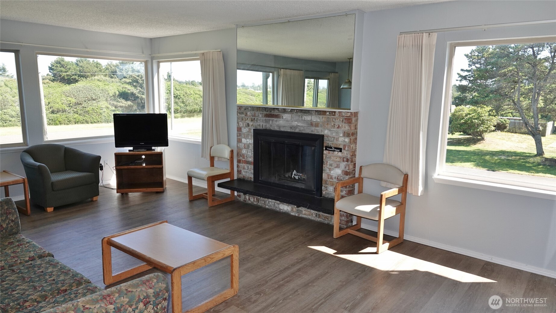 OCEAN/DUNES FRONT HOTEL CONDO! Rare 2 BD, 1.5 BA CORNER Condo available on the 2nd floor (#201) in the Polynesian Hotel in downtown Ocean Shores. CORNER unit with lots of windows for natural light with Eastern and Southern views towards the Poly Park. FULLY-FURNISHED with 988 sq.ft. Comfortable Living Room with a hide-a-bed couch, presto-log fireplace, LVP flooring, and a door to the South-side Deck. Dining Area and full-sized Kitchen with LVP flooring, all appliances, dishes, and a slider to the East-side Deck. Spacious hallways lead from the entry to the bedrooms and bathrooms. Large Master Bedroom w/ a King-sized bed, slider to the East-side Deck, and an attached 1/2-Bath. Another Full Bath, and a Bedroom with a Full/Queen Bed and Southern views. Ran as a HOTEL. OWNER CAN STAY UP TO 30 DAYS/YEAR at (currently) $65 per stay for the Cleaning Fee (per stay, NOT per night). Rental Income is divided as follows: 22% of the unit's revenue goes to the management co.; (currently) $1,145.89/mo to the HOA; any remaining revenue goes to the Owner. Owner is responsible for all of the items within their unit. HOA pays for all other expenses, ie utilities, building maintenance and insurance, etc. This unit is currently NOT a pet (dog) unit, but an Owner can make it a pet unit and add to the unit's revenue. On-site heated indoor pool & hot tub, social room, game room, lobby, elevator, a backyard lawn area, and a park. Property backs the Dunes Area (the Ocean/Beach lies beyond the Dunes).