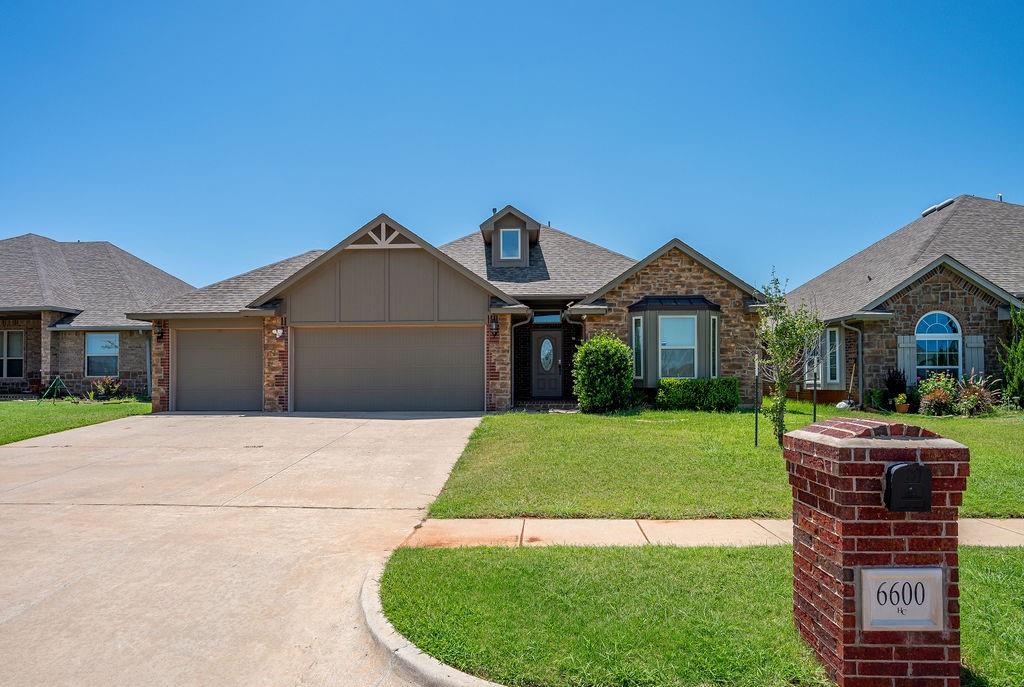 Welcome to Montague, where comfort, charm, and convenience come together beautifully! Step inside this stunning open-concept home and fall in love with the warm, inviting design. With a thoughtful split floor plan, each oversized bedroom offers the space you crave—plus walk-in closets for days! The heart of the home is the gorgeous kitchen, complete with rich granite countertops, a sleek stainless steel farmhouse sink, under-cabinet lighting, and custom maple cabinetry.  The primary suite is your own personal retreat, featuring a spa-like bath with a garden tub, a tiled walk-in shower, and not one, but two spacious walk-in closets. Enjoy cozy evenings by the elegant cast stone fireplace or step outside to your upgraded covered patio, perfect for morning coffee or weekend barbecues. With wood floors, a 3-car garage, and top-tier energy efficiency (plus built-in tornado safety features), this home is as practical as it is beautiful. Appliances included! EV charger in garage. Back patio plumbed for spa. Tucked in a prime location with an Edmond address, Oklahoma City taxes and utilities, and Deer Creek schools—this home truly offers the best of all worlds. Come experience the warmth and lifestyle of Montague.