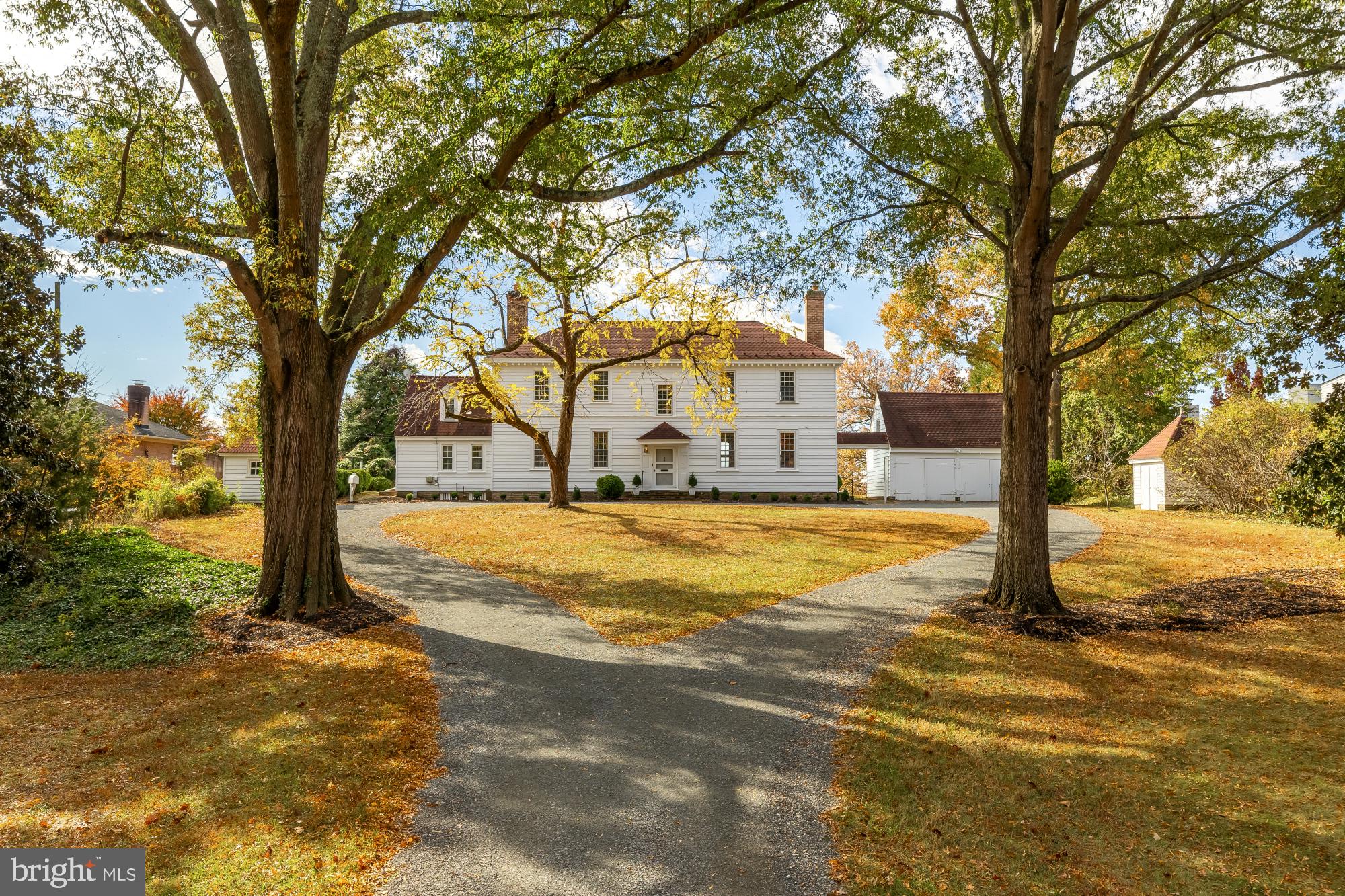 It’s rare that a home with such rich history, distinctive architecture, and an exceptional location becomes available to the public. Today, you're in for a special treat--a chance to explore an extraordinary residence that blends American history, timeless craftsmanship and endless potential! Once the boyhood home of General Winfield Scott--the legendary general who served in the War of 1812, the Mexican-American War, and the Civil War--this remarkable home began its story in 1762 in Sussex County, Virginia, known then as The Mitchell House. In 1946, it found new life when Carl W. Porter, Fairfax County's Director of Public Works and a retired U. S. Navy Captain, along with his wife, Beatrice, carefully relocated it piece by piece to its stunning new site--a serene two-acre setting on the Potomac River, just below George Washington's Mount Vernon. They lovingly renamed it CARLBY! Washington’s 1793 map of the Mount Vernon Estate shows Carlby as “Field Number 1” and the water in front of the home as George Washington’s fishery.Set back from the road and only 200 feet from the water's edge, this secluded 2.18 acre property is approached by a graceful lengthy driveway which is perfectly situated to reflect the symmetry of the home and its outbuildings. This elegant residence follows the grand tradition of Southern plantation design--with a wide central hall and front and back doors perfectly aligned to invite cool river breezes. As you step inside with both doors open, the view of the water unfolds before you in breathtaking fashion. The riverside facade can be admired from the stately portico, reminiscent of Mount Vernon's grand lawn. Whether hosting gatherings or savoring tranquil mornings by the water, the setting offers breathtaking views, timeless serenity and radiant sunsets. With 151 feet of beautiful water frontage and a pier extending into the river, the property presents endless possibilities for relaxation and recreation, all surrounded by a natural landscape that serves as a thriving habitat for local wildlife. Inside, the craftsmanship speaks for itself. The first floor showcases original wide-plank pine floors, soaring 12-foot ceilings, and beautifully preserved moldings and paneling. To one side of the main hallway lies the grand living room, adorned with intricate wainscoting and elegant woodwork restored by the Porters themselves. Expansive nine-over-nine windows fill the space with natural light and frame sweeping river views. Across the hall, the formal dining room features a stately fireplace and a custom chandelier designed by Captain Porter and inspired by one found in George Mason's home at Gunston Hall. A cozy den with its own full bath offers the versatility of a first-floor bedroom; each of these rooms features a beautifully detailed period fireplace. The galley kitchen, half bath, laundry area and a private staircase leading to an upstairs room complete the main level. Upstairs, the owner's suite spans the full width of the house--a peaceful retreat with original floors, an elegant wood burning fireplace and an en-suite bath. With views of both the front lawn and the river, it captures the quiet grace of the home's 18th century origins. Two additional bedrooms, a full hall bath and custom built-in closets round out the upper level--each space filled with charm and history, from river views to cozy fireplaces. A detached double garage with upper-level storage, a historic smokehouse, complementary shed complete the outside structures on the property; all arranged with balance & purpose. Carlby is more than a home---it's a living piece of American heritage. A place where history, architecture and nature converge in perfect harmony. For historians, architects, preservations and lovers of nature who are looking for a waterfront, private retreat on over 2 acres of land, the possibilities are endless. This is a once-in-a-lifetime opportunity to own something truly irreplaceable.