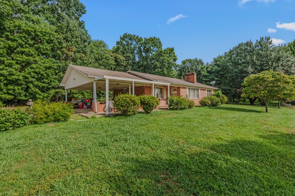 Welcome to 4535 Claudville Highway, Claudville, VA—a solid brick ranch situated on 1.202 acres offering endless potential for its next owner. This 3-bedroom, 1.5-bath home features a functional layout with a cozy living room complete with gas log fireplace, creating the perfect gathering space. The property also includes an unfinished basement, providing ample storage or the opportunity to expand your living space, as well as a 2-car attached carport for added convenience. With a little TLC, this home could truly shine. Whether you're looking for your next renovation project, an investment opportunity, or a place to make your own, this property offers great bones, a beautiful lot, and the peaceful setting. Don't miss the chance to add your personal touches and unlock this home's full potential!