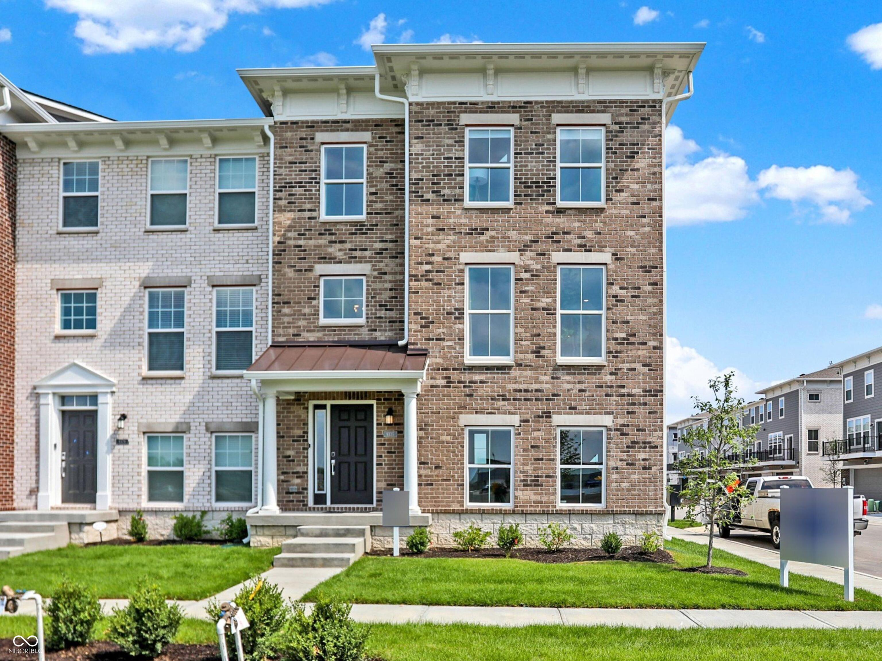 Custom Designer touches meet low-maintenance everyday ease! An end-unit with extra windows & flooded with natural light, this former Meridian townhome model home in Marketplace Towns balances style with flexibility, giving you room to live, work, and unwind across three open levels. Designer lighting, accent paint, and chic wallpaper accents add a touch of luxury you won't find in the other neighborhood townhomes. Step inside to an inviting foyer and open staircase that leads up to a light-filled, open-concept main level. The kitchen, breakfast nook, and great room flow together seamlessly, extending onto a private balcony. The upper level is anchored by a generous owner's suite featuring an eye-catching accent wall, statement chandelier, and spa-inspired bath. Two secondary bedrooms-each with their own designer details-share a full bath and offer plenty of space for guests, hobbies, or a home office. A finished flex room on the entry level adapts to your lifestyle-home gym, media lounge, or work-from-home studio-while an oversized two-car garage supplies ample storage. Marketplace Towns delivers low-maintenance living in the heart of Fishers, with quick access to I-69, Hamilton Town Center, top-rated schools, and an endless lineup of dining, shopping, and entertainment options. Premium landscaping, built-in security features, and meticulous model-home finishes mean you can simply move in and start living. Ready to elevate your everyday? Schedule your private tour and experience the Meridian model's perfect blend of style, comfort, and convenience.