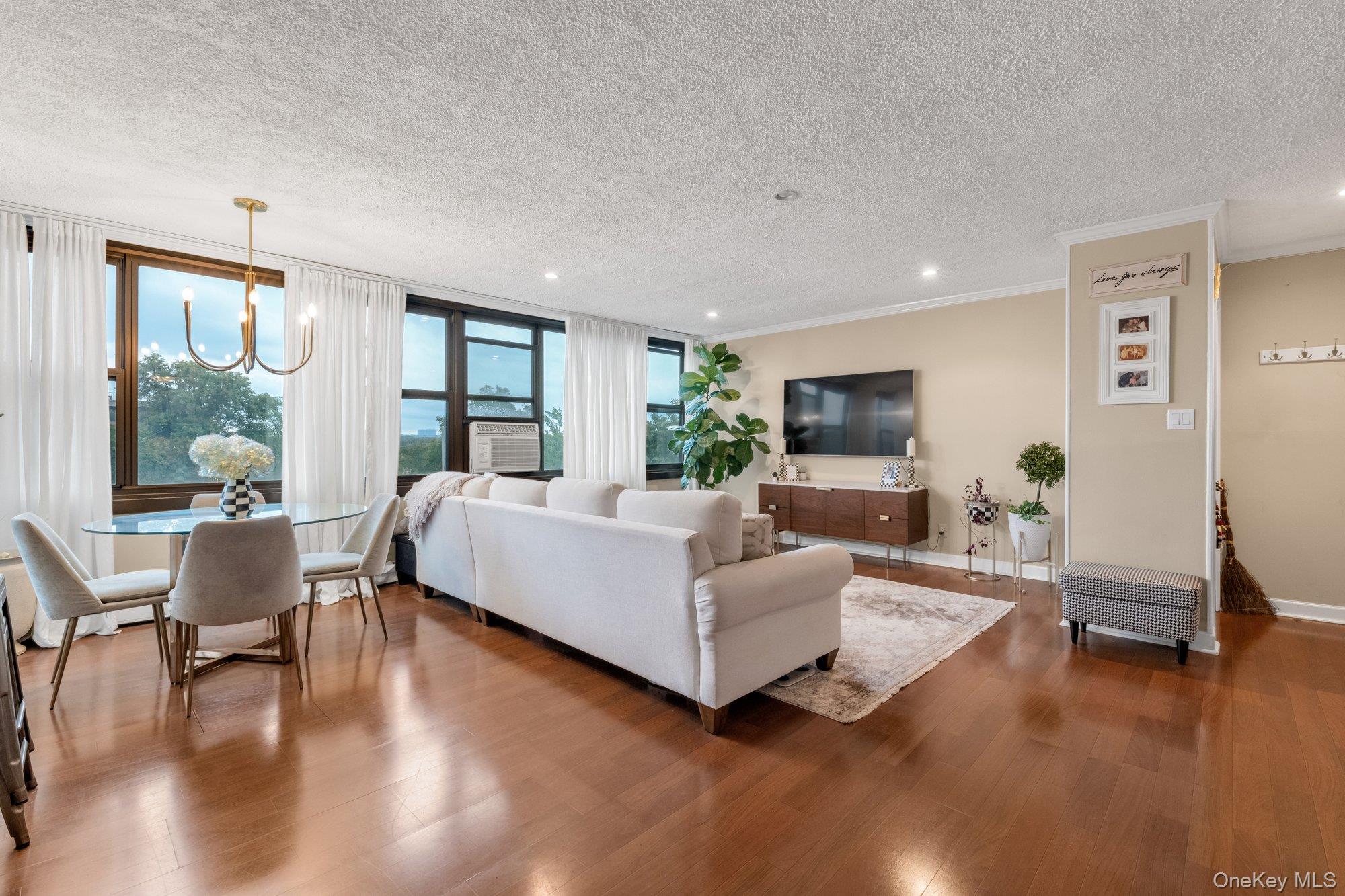 Ultra modern high floor with breathtaking open skyline and bridge views.  Expansive windows flood the apt with natural light. This stunning modern apartment features open concept layout, a unique find.  Recessed lighting. Updated kitchen with breakfast bar, stainless appliances and granite countertops. Thoughtfully designed with a bedroom that opens up to your private terrace.  Bonus bedroom/office/den for convenience. Laminate floors throughout.  Modern bath with storage.  Many organized closets. Parking space available G30 for transfer.  Lehavre offers 3 tennis courts, 2 outdoor pools, clubhouse/gym.