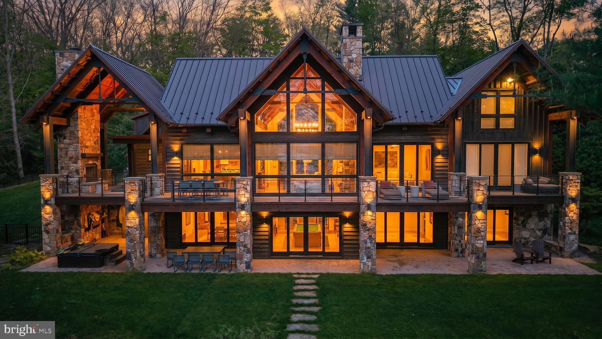 Luxury lakeview living at its finest. Perfectly positioned in one of Deep Creek Lake’s most desirable communities, this custom-built mountain retreat offers sweeping lake views, exceptional craftsmanship, and thoughtfully designed living spaces throughout. Built with quality and longevity in mind, the home showcases superior construction, soaring vaulted ceilings, exposed wood beams, expansive windows, and a stunning floor-to-ceiling stone fireplace that anchors the heart of the home.Designed for entertaining, the gourmet kitchen flows seamlessly into spacious dining and gathering areas, while multiple covered and uncovered outdoor living spaces invite you to enjoy the lake and mountain scenery year-round. The lower level is built for hosting with an impressive custom bar, recreation space, and additional room for guests.Rich wood finishes, upscale details, and a warm modern mountain aesthetic carry throughout the home. Outside, a spectacular fire pit gathering area creates the perfect setting for evenings under the stars overlooking the beauty of Deep Creek Lake. Located in one of Deep Creek Lake's premier residential communities, this exceptional property offers the perfect balance of luxury, privacy, quality craftsmanship, and lake lifestyle.s, and a warm modern mountain aesthetic carry throughout the home. Striking exterior architecture with stone accents, beautifully landscaped grounds, and an ideal location near Deep Creek Lake amenities complete this exceptional offering. Whether serving as a full-time residence or private vacation retreat, this home delivers luxury mountain living in a truly special setting. NOTE: Private residence. Showings are strictly by appointment only. Please do not access the property or grounds without a confirmed appointment and licensed agent present.