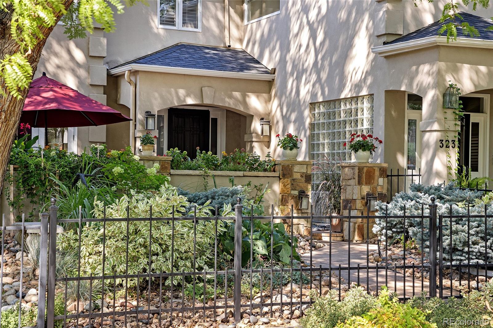 In Denver’s most desirable neighborhood, this stunning townhome has NO HOA and offers the perfect blend of luxury, charm, & comfort. Inside is a warm, inviting space filled with stylish finishes-an effortless ambiance. Every detail has been meticulously maintained, making this home move-in ready. The open-concept is accentuated by soaring ceilings, gorgeous hardwood floors, plantation shutters & abundant natural light. Walk into a comfortable living area anchored by a gas fireplace leading into a spacious private dining room. The floorplan flows effortlessly into the chef's dream kitchen by Williams Ohs w/ knotty alder cabinets, granite + quartzite counters, SS appliances. It opens to the family room a w/ a comfy gas fireplace. Upstairs, the primary en-suite is pure indulgence. Think spa vibes w/ a romantic gas fireplace, private balcony & 2 walk-in closets. The primary bathroom offers the ultimate relaxation experience with a deep soaking tub, dual vanities and a large glass-enclosed shower. Down the hallway is another en-suite bedroom. There is plenty of storage in the finished basement along with another bedroom, bathroom, and great room with built in book shelves. Attached is the oversized 2 car garage for added convenience. You'll fall in love with the AMAZING OUTDOOR SPACES! With your first steps from the street, open the rod iron gate to enter into the lush, professional landscaped garden. It will make you feel as if you walking into the Bridgerton garden, leading you to the beautiful, large private courtyard. But this is not the only outdoor space! Just off the family room is a large terrace with a retractable awning, ideal for al fresco dining and entertaining along with a balcony off the primary bedroom. And when it's time to explore, step outside and you are mere steps from the pulse of Cherry Creek North - world class dining, shopping, art and culture all at your fingertips. This isn't just a home. It's a mood. A moment. A move you won't regret.