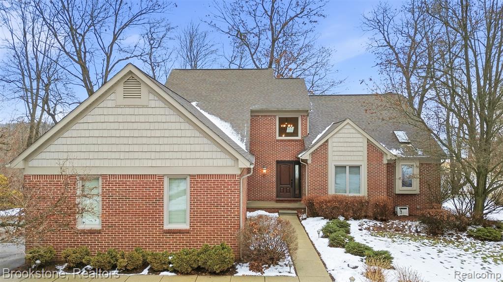 Welcome to a one-of-a-kind custom home on All Sports Big Lake nestled on nearly 12 acres in a peaceful corner of Springfield Township. Set back on a dedicated paved drive this meticulously maintained residence offers a blend of privacy, tranquility, and lakefront living. Offering panoramic views of Big Lake from multiple rooms and the sprawling deck. Stroll down the shared boardwalk to your exclusive lake frontage and additional yard space perfect for firepit, lawn furniture and front row seats for the annual Big Lake fireworks. Inside the first-floor master suite boasts a spa-inspired bathroom featuring jetted tub and glass enclosed shower. The Kitchen offers counterspace and storage galore.  Adjacent large dining room with views overlooking the lake can comfortably accommodate those large gatherings. Main level also has a versatile office/flex-room/den, laundry room and half bath. Upstairs, you’ll find two generously sized bedrooms and a full bath, offering ample space for visiting guests. Prepare to be amazed by the jaw-dropping finished walkout lower level. Cozy up by the gas fireplace, entertain at the show-stopping granite bar that features a sink, mini fridge, dishwasher, and electric cooktop. Get a workout in your own dedicated sprawling fitness room that could be used for an additional guest bedroom with adjacent lower level full bathroom with euro glass and custom vanity .  Unwind in the custom built-in McCoy dry sauna. There’s even room for a pool table and more making this space a true entertainer’s paradise. The property also features a spacious 3-car insulated and heated garage (w/ newly installed insulated garage doors), covered boat hoist, floating dock, central vacuum system, bonus attic storage, newer Anderson windows and sliding doors throughout. Also, surround sound speakers in living room and lower level. If you’re seeking a lakefront lifestyle with room to roam and every amenity, this exquisite lake home is everything you’ve been dreaming of.