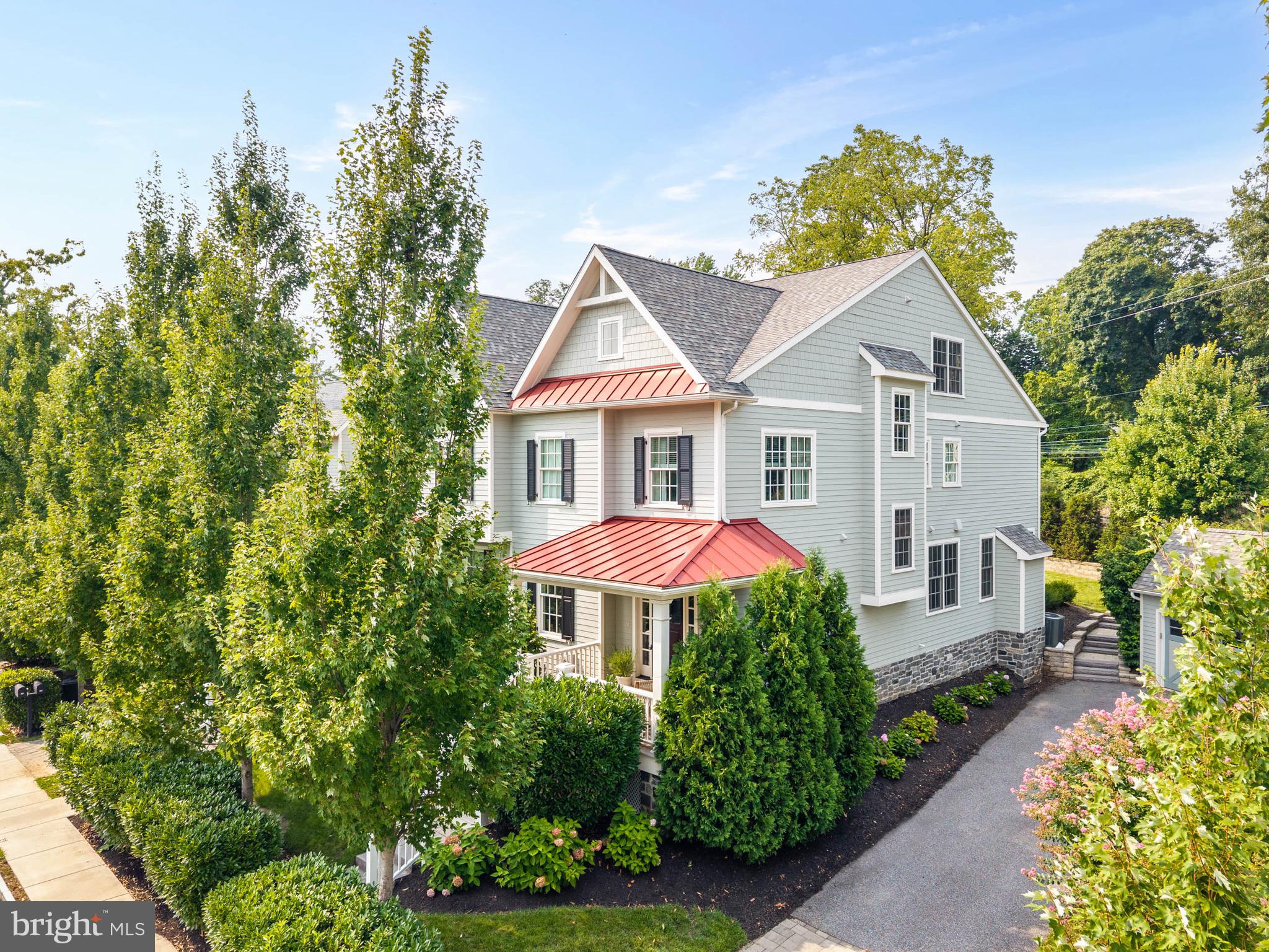 Nestled along one of the Main Line’s most desirable corridors, 503 Old Lancaster Road offers the perfect balance of timeless style, modern comfort, and exceptional functionality. Beautifully maintained landscaping, a welcoming covered front porch, and a thoughtfully designed interior create a home that is equally suited for everyday living and effortless entertaining. Step inside to a spacious, light-filled versatile front room, currently arranged as a formal dining and sitting area. Whether envisioned as an elegant dining room, living room, or flexible gathering space, this room adapts beautifully to your lifestyle. A convenient coat closet and powder room complete the welcoming entrance. At the heart of the home, the open-concept kitchen and family room provide an inviting setting for family and friends to gather. The eat-in kitchen is thoughtfully appointed with stainless steel appliances, granite countertops, a center island with seating, and a walk-in pantry that offers abundant storage. Just beyond, the family room is anchored by a gas fireplace and detailed coffered ceiling, creating a warm and inviting atmosphere. Glass doors seamlessly connect the living space to the backyard patio, making indoor-outdoor entertaining effortless. The second floor is filled with natural light and offers a well-designed layout centered around comfort and convenience. The spacious primary suite serves as a private retreat, complete with room for a sitting area, an oversized walk-in closet, and a luxurious ensuite bath featuring dual vanities, a large walk-in shower, a private water closet, and a linen closet. A conveniently located laundry room sits just outside the primary suite, while two additional generously sized bedrooms, each with double-door closets, share a well-appointed hall bath with dual vanities and a tub/shower combination. The third floor provides an ideal private guest suite or fourth bedroom. This spacious retreat includes its own ensuite bath with a tub/shower combination, a walk-in closet, an additional double-door closet offering both comfort and privacy for guests or extended family. Across from the guest suite is a storage room perfect for all your seasonal decor. The finished lower level expands the home’s living space with endless possibilities. A large open recreation area is perfectly suited for a game room, home gym, playroom, or office space. A powder room, oversized storage closet, and an additional entertaining room complete with a dry bar and beverage refrigerator make this level ideal for hosting gatherings or creating the ultimate hangout. Outside, the generously sized backyard offers room to relax, play, and entertain. A patio provides the perfect setting for outdoor dining and summer evenings, while the detached two-car garage adds convenience and additional storage. Located within walking distance to the Haverford train station and all the restaurants, grocery stores, and boutique shops W Lancaster Ave has to offer. You won’t want to miss this opportunity!