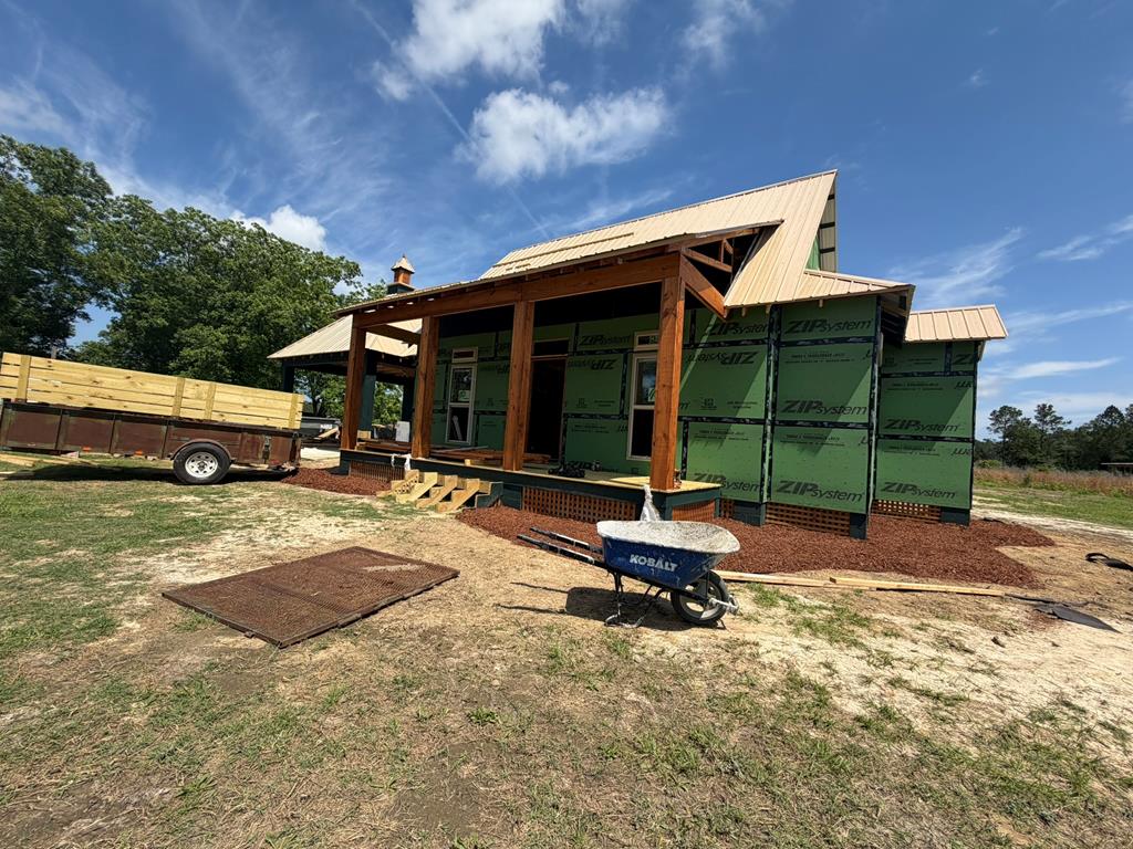 Big Living in Cottage Home on 3.35 Acres!  New Construction.  Too Big to be called Tiny!  Check this home out!  Looks good and feels good from the first floor to the second floor...from the front porch to the back porch!  New Deep Well.  145,926 Sq Ft of space to do with as you please!  Garden Space!  Planted Pines!  Pasture Area!  Shop Area!  Maybe you could use the land for a little bit all those uses.  Contract now and you may have a little more input into the final product as the builder nears the finish line on this beautiful home.  342+/- Sq Ft Carport connects to home by breezeway.    This really is a feel good home.  Take time to check it out and consider how you could make use of all the extra acreage.  As the home nears completion more details and pics will be added.  Property Taxes not determined yet.  Convnenent drive back in to Thomasville.