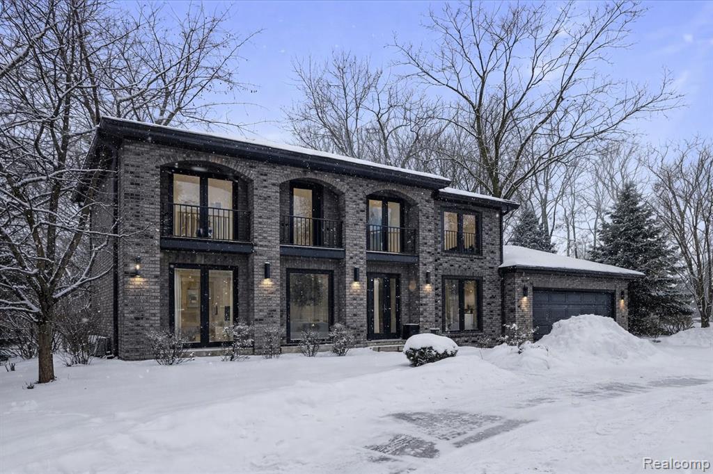 *First two images are renderings.* Welcome to this beautifully cared-for West Bloomfield home, where everyday living meets outdoor adventure with walking and biking access to the West Bloomfield Nature Preserve. Designed for comfort and functionality, the home features custom John Morgan built-ins and a sunken family room anchored by a wood-burning fireplace. Thoughtfully finished with high-end details throughout, this home showcases a Jodi Caden kitchen, complete with a Wolf cooktop and double ovens, SubZero refrigerator and freezer, inset custom cabinetry, and a granite island with bar seating and additional storage. An open, flowing layout leads from the living room into the dining room, where hardwood floors add warmth and continuity. The main floor is enhanced by a laundry and mudroom that add everyday convenience, a tasteful powder room with granite countertops, and a home office with custom built-ins;The stunning primary suite offers vaulted ceilings and an ensuite bathroom with a Euro glass shower and walk-in closet. Three spacious bedrooms are complemented by a shared hallway full bath equipped with a tub/shower and two sinks. The finished lower level blends practicality and play, offering ample storage, a versatile recreation area, and a dedicated play space. Enjoy peace of mind with the newly replaced furnace, humidifier, and thermostats. Beautifully maintained and thoughtfully designed, this home offers comfort, style, and versatility and is ready to welcome its next owners.