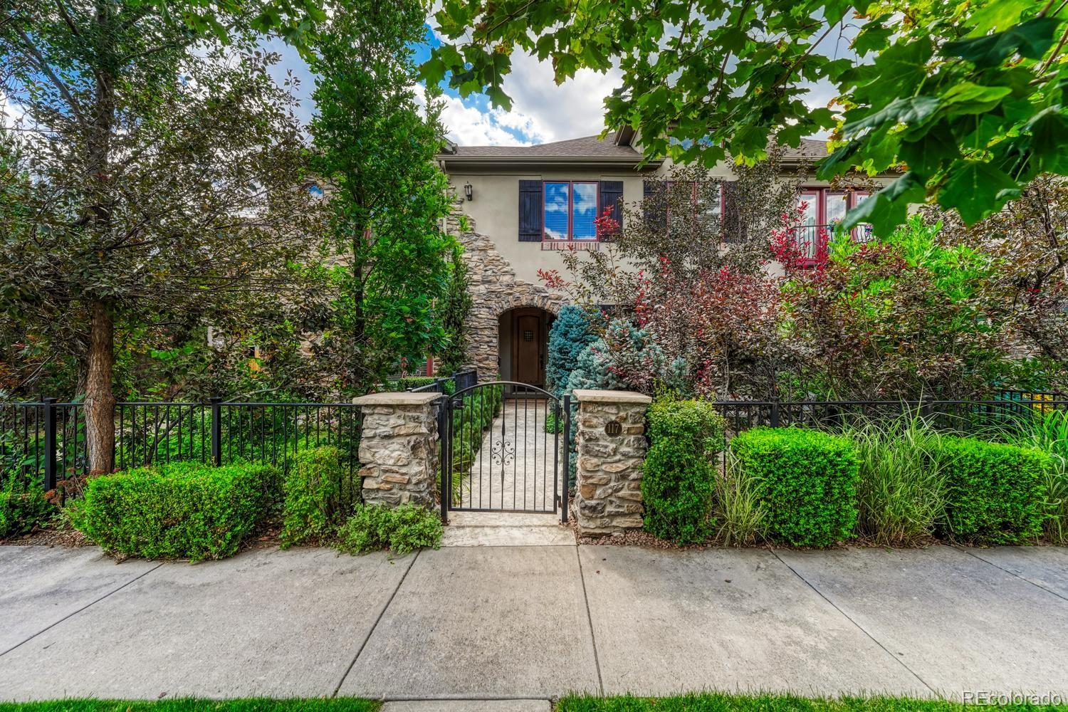 Experience the ease of Cherry Creek North living in this beautifully appointed 3-bedroom, 4-bathroom townhome that lives more like a single family residence. Thoughtfully designed indoor and outdoor spaces include a welcoming front courtyard and a private backyard patio, ideal for relaxing or entertaining. The main level features an inviting, open layout enhanced by beautiful custom details throughout. Custom William Ohs cabinetry provides exceptional storage and craftsmanship just off the kitchen, while a private, exceptional office positioned between the main and upper levels creates a quiet, dedicated workspace. Upstairs, the spacious primary suite offers a luxurious 5-piece ensuite bathroom. A second bedroom features its own ensuite bath, and the versatile loft provides space for an additional office, play area, fitness space or reading nook. The conveniently located upper-level laundry room adds everyday functionality. The finished basement is designed for entertaining, with a game room area, a comfortable great room with an electric fireplace and a custom wet bar featuring additional William Ohs cabinetry. An additional flexible bonus area can be tailored to suit a variety of needs. The lower level also includes a third bedroom, full bathroom and a second laundry room currently used as a wellness room. Located near the renowned Cherry Creek shopping district, exceptional restaurants and neighborhood amenities, this distinctive home offers generous living spaces, privacy and custom craftsmanship in one of Denver’s most desirable locations.