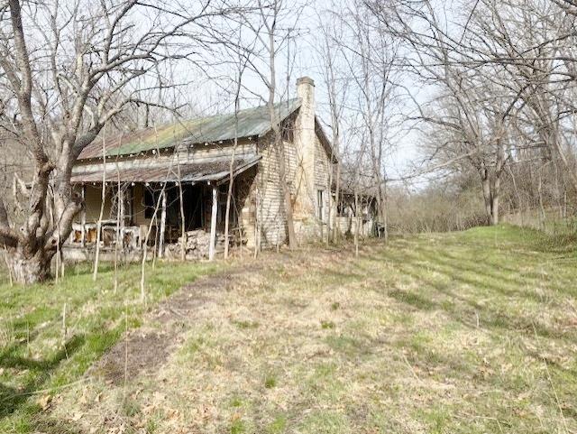 1.22 acres of land with an old house on site. Private, country location. Could be a nice home site again.