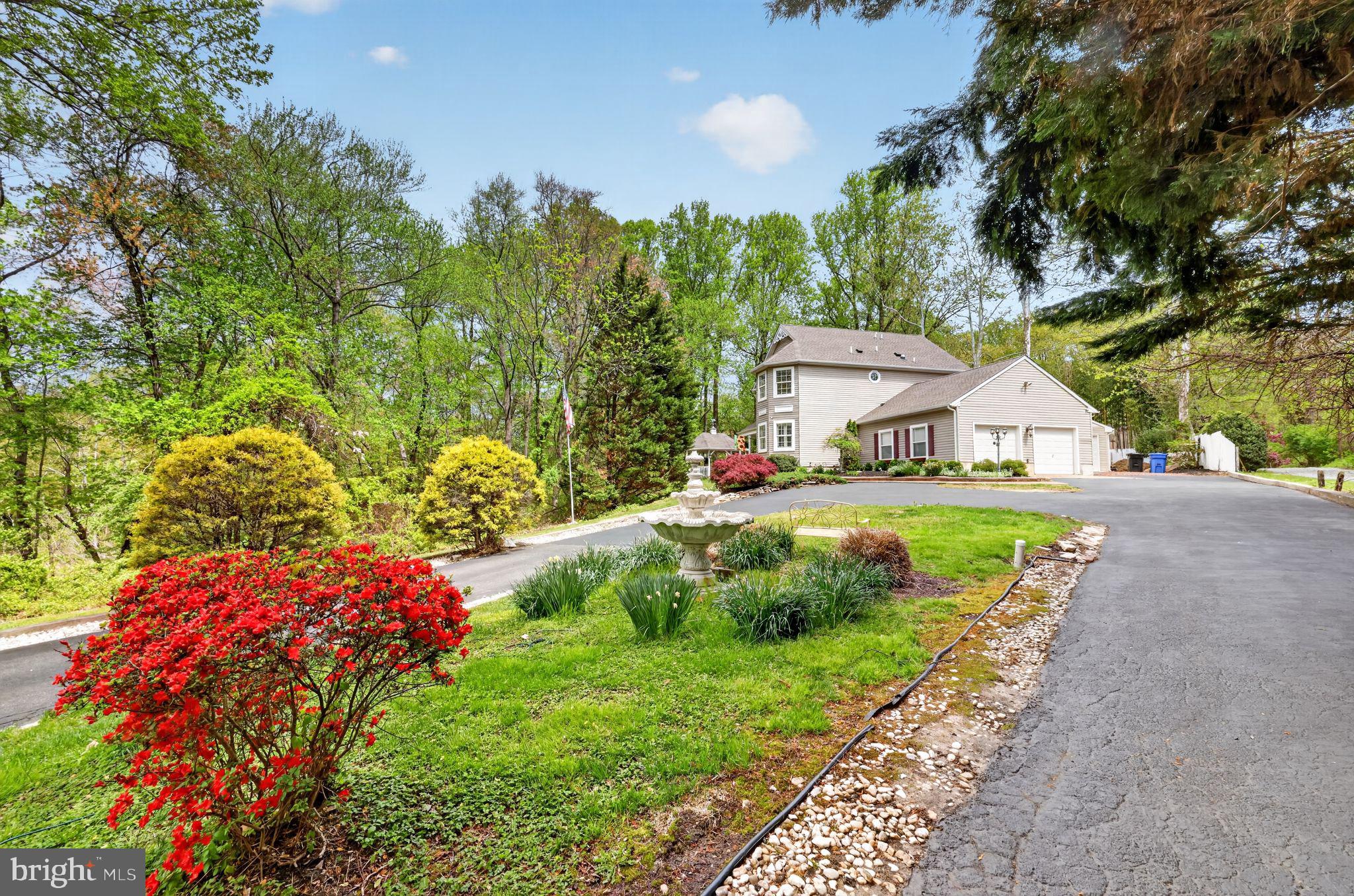 Beautiful Victorian-style 3-bedroom 2-1/2 bath home on a semi-private 1.72+/- acre lot, located in desirable Washington Township of Gloucester County. The home includes an attached 2-car garage PLUS an additional 20 x 24 detached outbuilding and sits back off the road, presenting the natural privacy of protected lands, enjoyable from the rear patio and gazebo. Enter from the front porch into the beautiful living space with a large family room and a front welcoming room with bay windows. The family room then opens into the upgraded kitchen area showing granite countertops with abundance of cabinet space. Main floor laundry is very convenient.  The spacious main bedroom includes a sitting room with bayed windows and ample closet spaces. This suite also features a garden soaking tub and separated shower stall.  There are two additional ample-sized bedrooms with large closets, and the shared hallway full bath. The Basement is partially finished with a gym area and a theater room, as well as a large separate storage room. NEW Roof & Gutters just completed! Conveniently located within ¼ mile of the elementary, middle schools, approx. ½ mile from the high school, and minutes from shopping, dining, major highways, and local parks! There are NO pets nor smokers in this house! Come and see this lovely home for yourself, you will be pleasantly surprised - Make your appointment today!