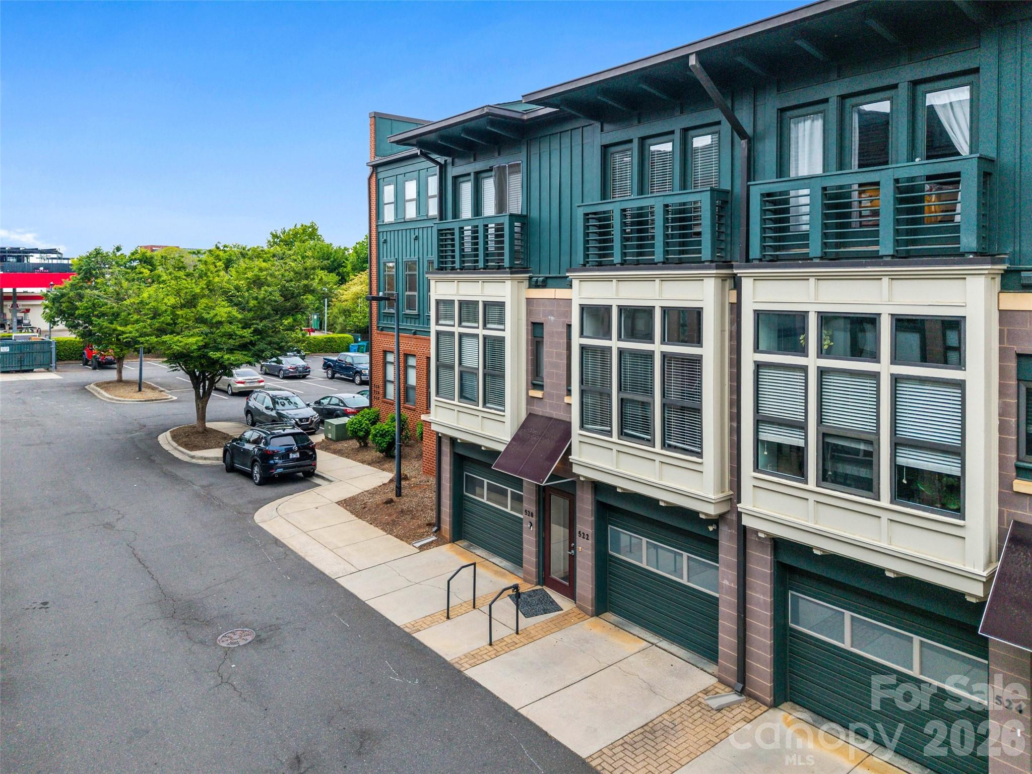 Chic, Move-In Ready Townhome in the Heart of South End – Incredible Value!Step out your front door and straight into the energy of South End—one of Charlotte’s most vibrant and desirable neighborhoods. Located just steps from the Lynx Blue Line Light Rail at New Bern Station, this home offers unbeatable convenience with effortless access to Uptown, top-rated dining, breweries, boutique shopping, parks, and major hospitals. Freshly painted and impeccably maintained, this stylish townhome-style condo blends modern design with everyday functionality. The sun-drenched main level features soaring 10-foot ceilings, dramatic floor-to-ceiling windows, and a versatile open layout perfect for entertaining or working from home. Flex space for an office, spacious living area, and convenient half bath make this level as practical as it is beautiful.At the heart of the home, the kitchen shines rich maple cabinets, granite countertops, stainless steel appliances, and a sizeable pantry—ideal for both daily living and hosting. Upstairs, retreat to two generously sized bedrooms one offers 2 closets! Each have its own private en-suite bath, offering comfort and privacy for residents and guests alike. A conveniently located laundry closet completes the upper level. The lower level delivers rare flexibility with a tandem two-car garage—perfect for parking, extra storage, a home gym, or creative workspace. Unwind on your private courtyard-facing deck, a peaceful escape from the city buzz and a perfect spot for morning coffee or evening relaxation. Urban lifestyle, modern comfort, and unmatched convenience—this is your opportunity to own in South End at an incredible price point. Don’t miss it. Schedule your private tour today.