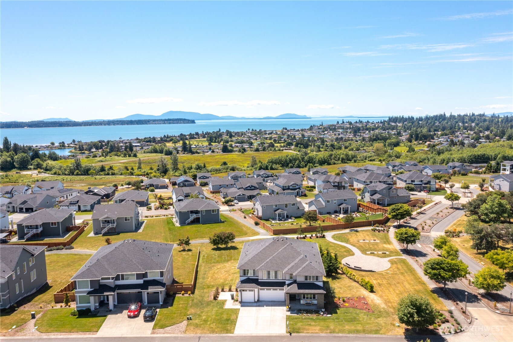 New price on this better than new fully upgraded and high-end appointed stunning! Every space that matters is positioned perfectly to capture the peaceful pause mid-step view of Birch Bay, Mt. Baker & islands. Soaring two story foyer leads the way to expansive great room with continued soaring ceilings, spacious dining area and high-end chef's kitchen. Enjoy cozy evenings by the gas fireplace in the living room or head over to the great size den & enjoy a nice glass of wine. Gorgeous kitchen is heart of home with eat-in island, ample cabinets, stainless steel appliances, butler pantry plus huge walk-in pantry. Imagine prepping meals while gazing out at the bay, enjoying dinner on your custom trex deck with outdoor fireplace. Second level includes generous bay-facing owner's suite with even better vantage point, full ensuite bathroom & walk-in closet. 3 more bedrooms, laundry, 2 more bathrooms & large multi-purpose space fully utilize well-planned second level partially open to floor below.