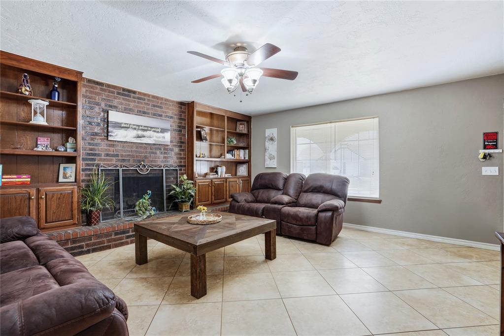 Welcome home to this spacious and thoughtfully designed two-story home in the heart of Moore! Offering 1888 sq ft three oversized bedrooms, two full bathrooms, and flexible living spaces throughout, this home combines comfort, function, and room to grow.The inviting living room features a cozy fireplace and opens naturally into the kitchen and dining area, creating a warm and functional space for everyday living and entertaining. The kitchen includes a center island, gas range, large pantry, and window over the sink, offering both convenience and charm.  The downstairs primary suite features a walk-in closet and private bathroom, creating a comfortable retreat tucked away from the upstairs living areas. Upstairs you'll find two additional oversized bedrooms and a full bathroom. One upstairs bedroom includes an attached oversized flex space that offer endless possibilities-perfect for a home office, gaming room, media room, hobby space, homeschool area, workout room, or private retreat.  Step outside to enjoy the spacious backyard and large patio, ideal for cookouts, gatherings and relaxing evenings.Additional features include In-ground storm shelter, oversized two-car garage, two central heat and air units, Washer, dryer and refrigerator, Gutters already installed.Conveniently located near schools, shopping, and everyday amenities, this move-in-ready home offers a unique layout with flexible spaces