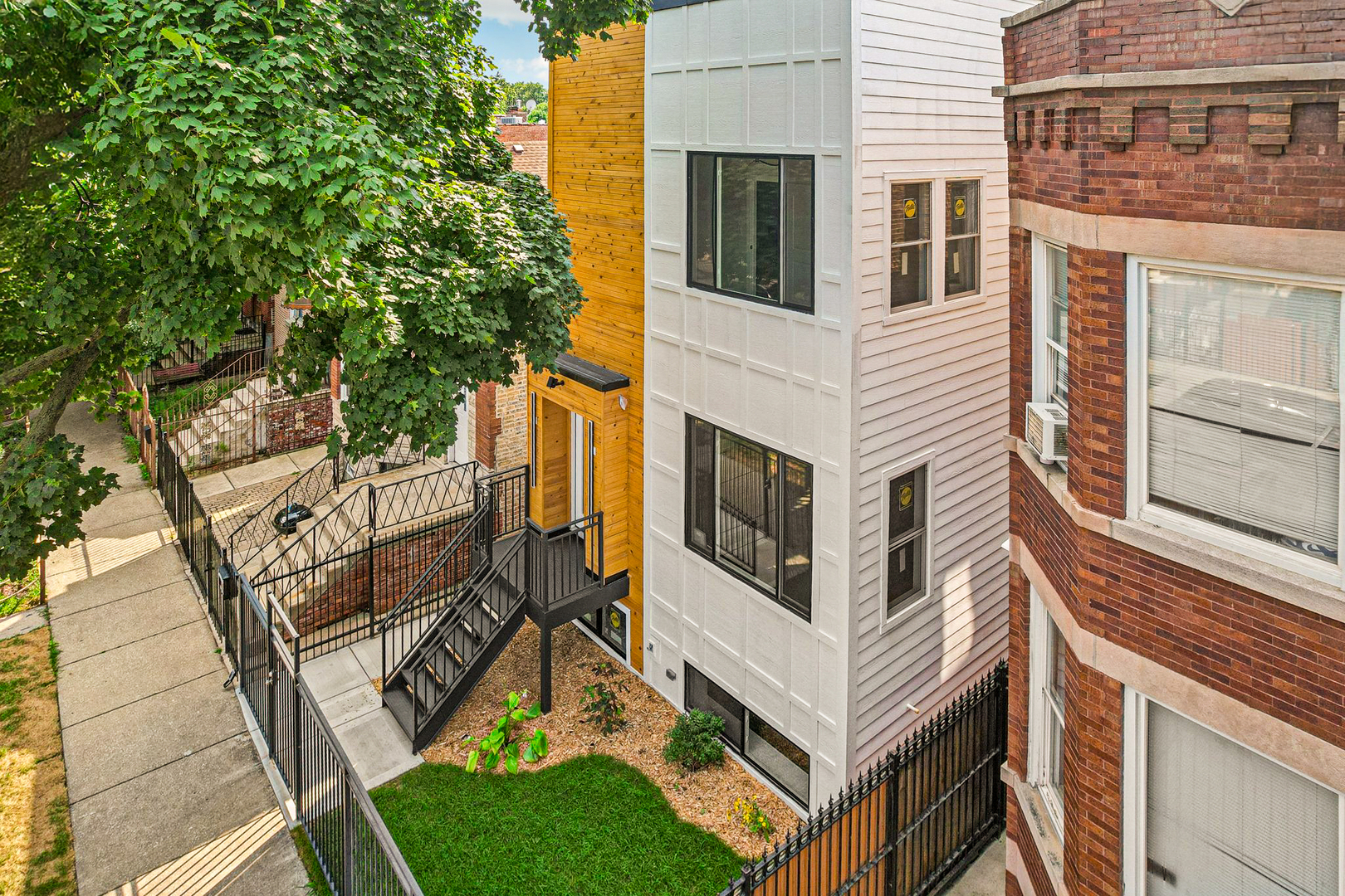Luxury Meets Modern Living in West Humboldt Park: Welcome to this stunning new construction single-family home, perfectly situated in the rapidly growing West Humboldt Park neighborhood. Thoughtfully designed for both comfort and sophistication, this multi-level residence offers 5- spacious bedrooms, 3.5 luxurious bathrooms, a cozy family room, a flex-room/ space, and multiple outdoor living areas, including an expansive rooftop deck. With a 2-car garage and elegant design elements throughout, this home truly has it all.  Exceptional Interior Design & Thoughtful Layout: Step inside through the inviting front entrance and be greeted by an open-concept floor plan bathed in natural light. The living room, dining area, and chef's kitchen flow seamlessly together, creating a perfect setting for everyday living and entertaining. Large, energy-efficient windows highlight the beauty of the light wood floors that run throughout the home.   The chef's kitchen is a true showstopper, featuring sleek black shaker cabinetry, quartz countertops, a full-height backsplash, and a large island with breakfast bar seating-ideal for casual dining or hosting guests. High-end stainless steel appliances, including a French door refrigerator and an externally vented range hood, add both style and functionality. A walk-in pantry ensures plenty of storage space for all your culinary needs.   Expansive Living Spaces: The lower level boasts impressive 9-foot ceilings, offering a spacious family room, an additional guest bedroom, and a full bath. A versatile oversized room provides the perfect space for a home gym, playroom, or media room, with seamless access to the backyard.    Upstairs, the primary suite is a private retreat, complete with a spacious walk-in closet and a luxurious en-suite bathroom featuring dual showerheads and designer finishes. This level also includes two additional bedrooms and a full bathroom, with one bedroom ideal for a sun-filled home office.    Unparalleled Outdoor Living: A striking staircase leads to the private rooftop deck, offering a serene escape with breathtaking views-perfect for entertaining, relaxing, or enjoying warm summer nights. Additional outdoor spaces include a gracious front porch, a backyard, and a garage rooftop deck, providing multiple options for entertaining and outdoor enjoyment.    Prime Location & Unbeatable Convenience: Enjoy the best of West Humboldt Park with easy access to:   Humboldt Park Boathouse, Beach, Tennis Courts, & Cultural Center   The 606 Trail   Public Transportation   Restaurants, Cafes, & Shopping in Nearby Business Districts    Premium Features & Upgrades:    Hardwood flooring throughout   Dual-zoned heating & cooling   Lower-level entertainment space with beverage refrigerator & additional storage   Spacious laundry room    This exceptional new construction home checks all the boxes-high room count, stunning design, incredible outdoor space, and garage parking. With the neighborhood's continued growth and revitalization, this is not only a dream home but also a smart investment opportunity.  Don't miss out-schedule your showing today and secure your place in one of Chicago's most exciting neighborhoods!