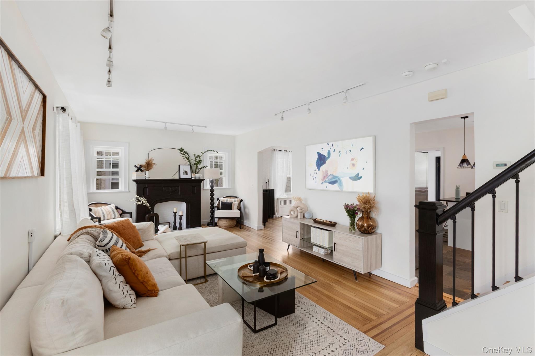 Nestled in the sought-after Fleetwood neighborhood, this charming home offers both convenience and comfort. Enjoy tree-lined sidewalks and easy access to Metro-North, major highways, and nearby shopping. Step inside to an inviting foyer that leads to an open living space, where stunning hardwood floors flow seamlessly into the dining and kitchen area. The kitchen is a chef’s delight, featuring granite countertops, radiant heated floors, and a pantry for ample storage.A full bath is conveniently located on the main level, along with access to the deck—perfect for entertaining or simply unwinding in your private backyard retreat. Upstairs, the second level boasts a serene primary bedroom along with two additional bedrooms, all thoughtfully designed for relaxation. Another full bath with radiant heated floors completes this area.The third level offers a versatile, finished attic space (300sqft) - providing endless possibilities while not included in the official square footage. Downstairs, the well-maintained basement features a laundry area, a half bath, and unfinished storage. Additionally, a finished recreation room offers direct access to the driveway.With a motivated-seller, its prime location and move-in-ready appeal, this home is a true gem waiting to be yours!