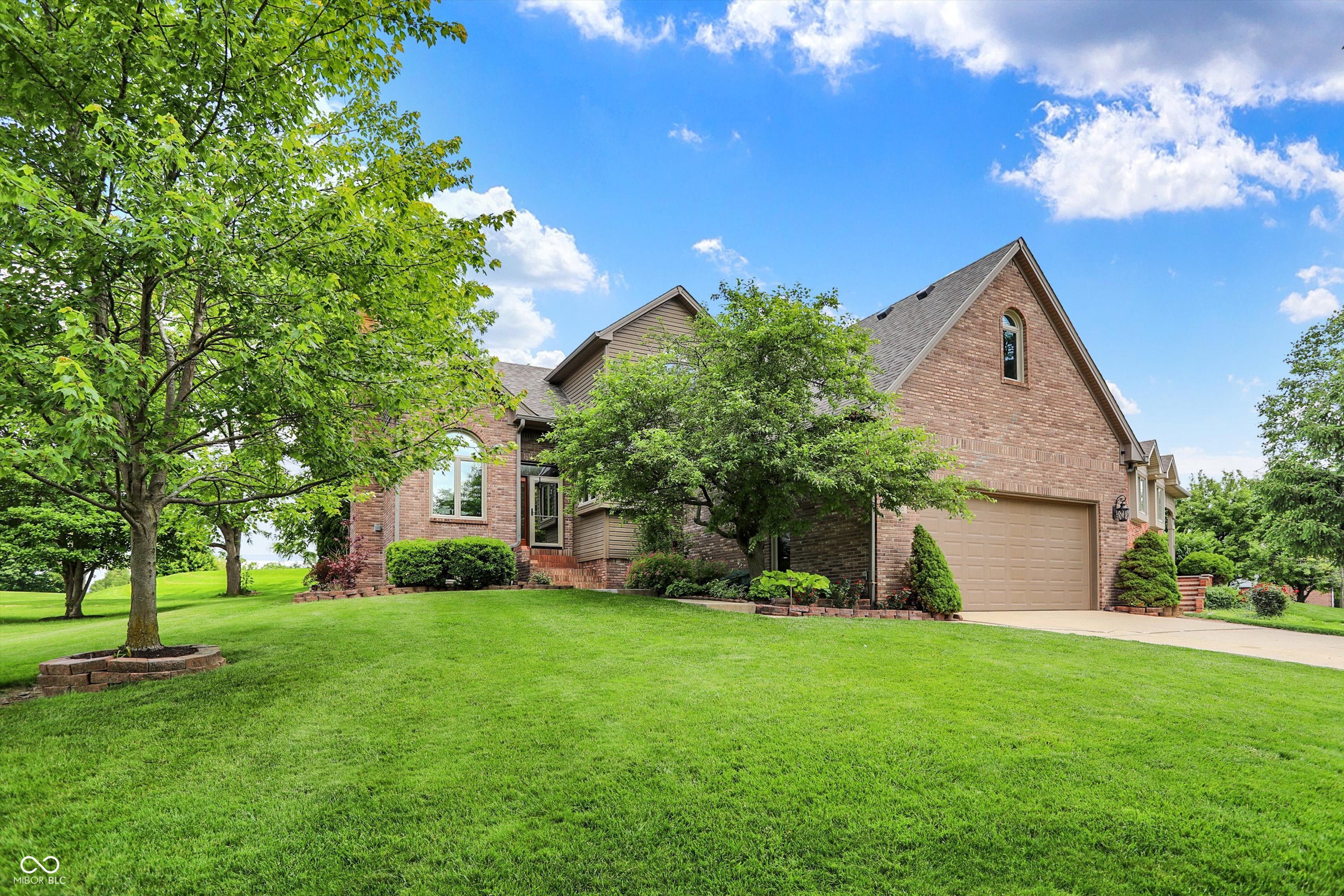 Charming Brick Two-Story with Full Finished Basement on the 18th Tee at Hillview Country Club in Franklin.  Welcome to this beautifully maintained 4-bedroom home with stunning golf course views and exceptional curb appeal. Situated on the 18th tee box of the private Hillview Country Club, this residence offers a perfect blend of elegance, style, and convenience.  Step inside to an inviting great room featuring a coffered ceiling, wood-burning fireplace, and sliding glass doors that open to a large wood deck-ideal for entertaining, grilling, or simply relaxing as you watch golfers tee off. Recent updates include new exterior doors/ windows (installed in 2022), roof (replaced in 2025), and Bosch Geothermal unit (installed in 2023) ensuring peace of mind for years to come.  The main floor includes a spacious primary suite for added convenience, while the upper level features a unique Jack-and-Jill layout and an expansive bonus room with attic access.  FRESHLY PAINTED KITCHEN CABINETS & KITCHEN/DINING AREA!   The full finished basement offers versatile living space with an open living room, a private mechanical room, and a flexible rec/workout room. A heated two-car garage with tall ceilings provides excellent storage options.  Located just minutes from I-65 and vibrant downtown Franklin-filled with local shops, dining, parks, and an amphitheater-this home combines serene golf course living with easy access to amenities.