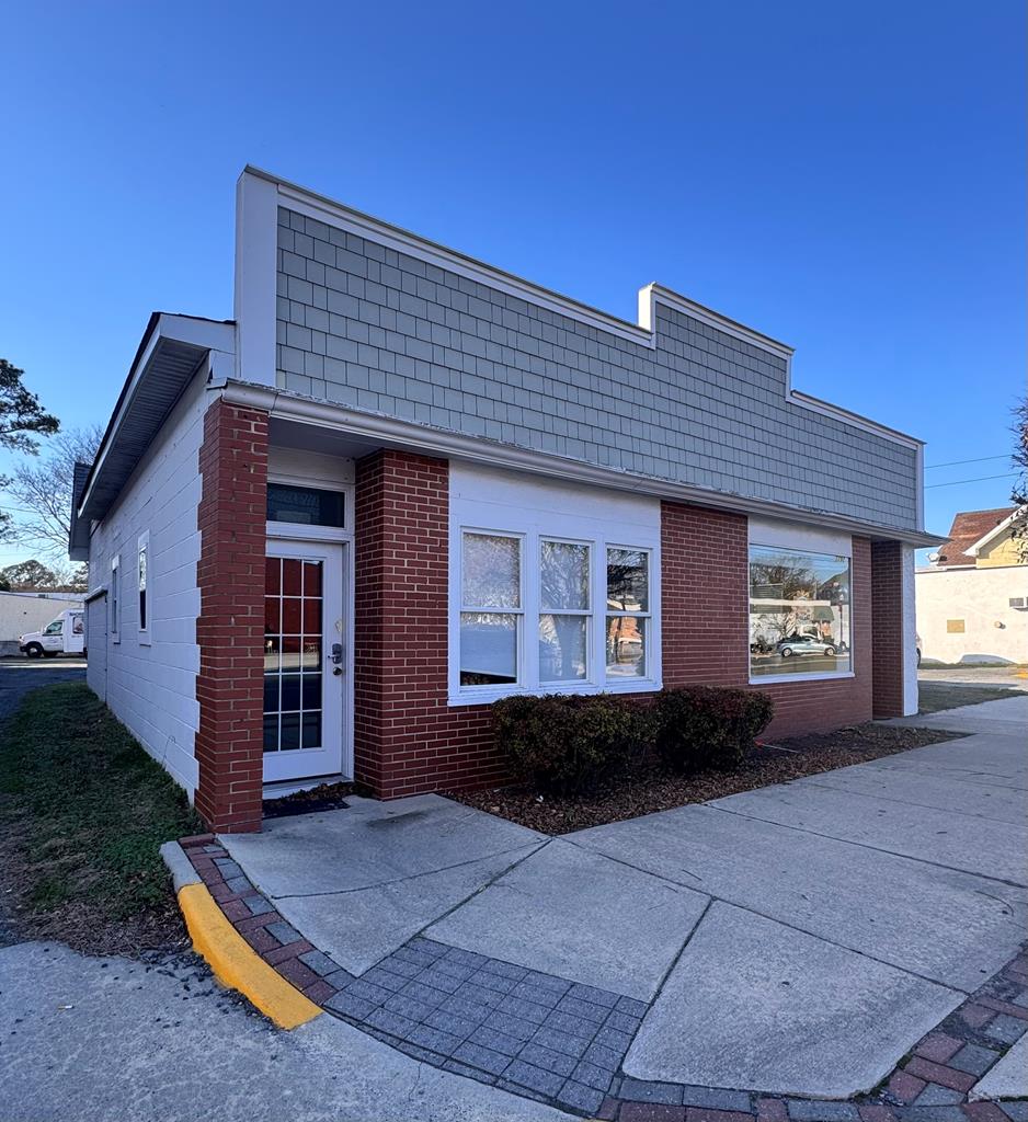 Prime Main Street commercial opportunity at 3292 Main Street in Exmore, VA. This versatile property includes two street-facing retail/office units with excellent visibility plus a separate 1,200 SF warehouse building at the rear. One unit is leased to a popular year-round bakery/coffee shop through December 2026 and includes a kitchen, bath, large front entry, and seating (equipment owned by tenant). The adjacent unit was previously shared office space with a large front room, private rear office, and bath—ideal for office, retail, or studio use. Warehouse is currently leased for inventory storage. Located in the heart of Exmore's downtown commercial corridor, offering immediate income and future value-add potential.