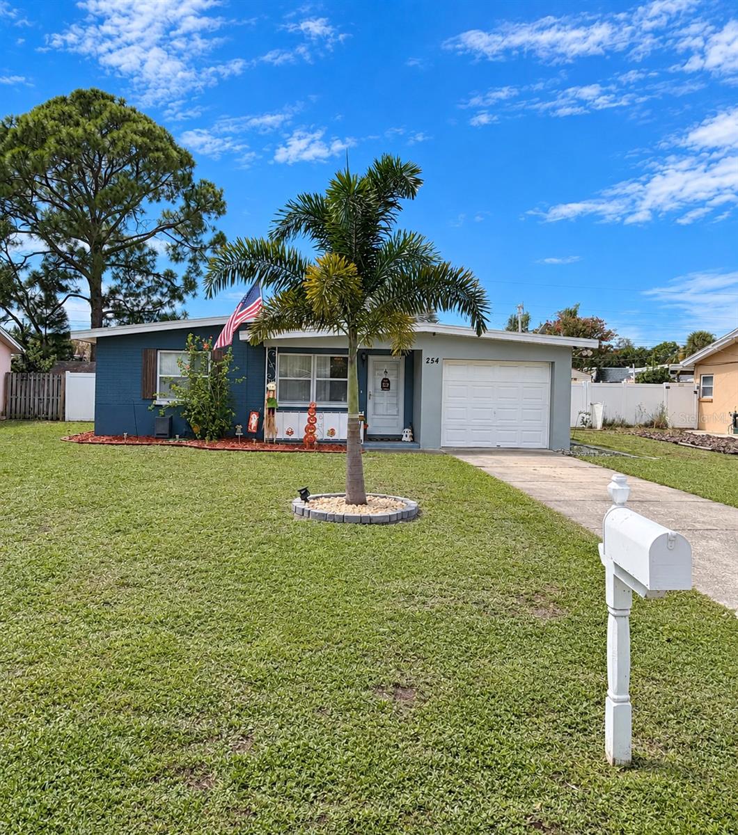 WELCOME HOME! BEAUTIFULLY UPDATED, ENERGY-EFFICIENT & FULL OF EXTRAS! This meticulously maintained 2-bedroom, 1-bath home with over 1,300 sq. ft. and a 1-car garage offers an impressive combination of comfortable living, flexible bonus spaces, outdoor enjoyment, and valuable updates—all tucked away on a quiet dead-end street in the heart of Largo! Step inside to an open and inviting living area featuring soaring vaulted ceilings, NEW luxury vinyl flooring throughout the main living area and bedrooms, and a built-in TV armoire with integrated lighting and surround sound. The spacious bedrooms are conveniently located near the well-appointed bath. The updated kitchen with newer appliances flows into the laundry area and garage, which is currently utilized as additional storage and features its own A/C. At the rear of the home, a separate bonus/media room provides the perfect space for music, hobbies, entertainment, or simply relaxing. A pull-down attic staircase offers additional storage for seasonal items. Sliding glass doors lead to the back porch and terrace area, perfect for outdoor seating or even a future hot tub. The spacious backyard is enclosed with pressure-treated wood fencing and features a fire pit plus an 8' x 10' storage shed for lawn equipment, tools, and more. Energy-conscious buyers will appreciate the solar panel system with transferable warranty, along with a backup battery valued at approximately $10,000. The current solar payment is approximately $236 per month, with an approximate remaining balance of $38,000. According to the seller, average monthly electric bills have typically been only $30-$50, offering the potential for significant monthly energy savings. Buyer to verify solar terms, transfer requirements, balance, warranty, and utility costs. Additional features include newer double-pane windows and a security system with interior and exterior coverage, adding comfort, efficiency, and peace of mind. Enjoy a convenient Largo location just a short walk from the Largo Recreation Center, with shopping, restaurants, parks, entertainment, and Florida's beautiful Gulf beaches all within easy reach. With its NEW flooring, solar energy system, backup battery, fenced backyard, bonus living spaces, abundant storage, and fantastic central location, this home has so much to offer. Schedule your private showing today—this is one you won't want to miss!