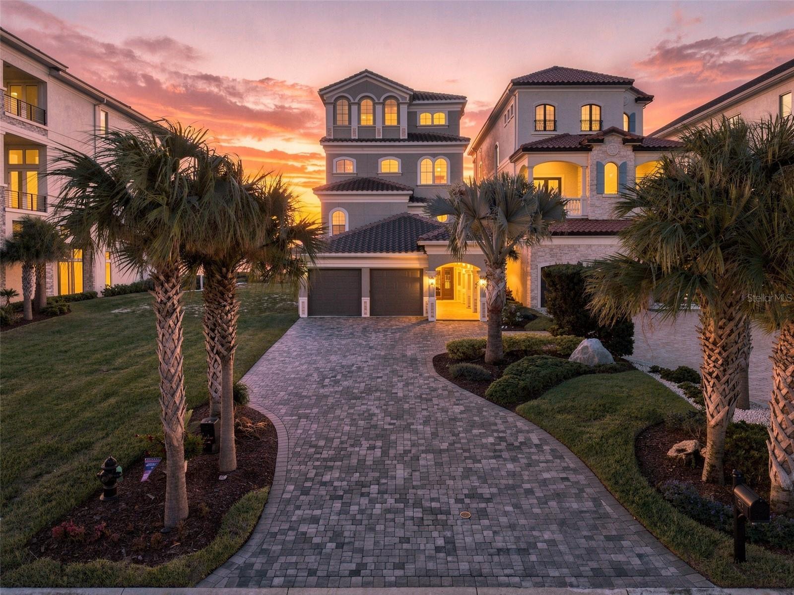 52 Hammock Beach Circle | Oceanfront Elegance Meets Championship GolfWelcome to 52 Hammock Beach Circle—the crown jewel of Ocean Hammock and the largest oceanfront estate directly along the 9th hole of the iconic Jack Nicklaus Ocean Course. Spanning four levels and over 6,800 sq. ft. of refined living space, this concrete-built coastal retreat features rich travertine flooring, sweeping unobstructed ocean and fairway views, and elevator access to all floors.Designed for entertaining, Level 1 offers a custom full-service bar, fireplace living room, private media room, and accessible guest accommodations. Essential peace of mind is provided by a whole-house generator, integrated fire sprinkler system, and whole-house water filtration.Level 2 serves as a dedicated guest sanctuary featuring four suites—including two oceanfront retreats with direct balcony access—a built-in coffee/wet bar, and a laundry room.The heart of the home unfolds on Level 3 with an expansive great room, dining area, and chef’s kitchen featuring premium Sub-Zero and Wolf appliances, a central island, and a walk-in pantry. Relax in the architectural half-moon lounge with custom curved windows framing panoramic ocean vistas.Occupying the entire 4th floor, the private primary suite offers direct ocean views, an executive office, a second laundry room, and a spa-inspired bath with a grand multi-spray rain shower.Outdoor living excels with direct beach access, an al fresco cooking center, a firepit on the brick paver terrace, and steps-away access to the resident-only pool. Additional highlights include an Apple Home smart automation system, fully maintained HOA landscaping, and meticulously kept mechanics (serviced 4-unit HVAC with attic dehumidifier, yearly elevator service, 2026 resealed pavers, and fresh 2025 exterior paint). Optional Hammock Beach Golf Resort & Spa membership grants access to world-class golf, dining, tennis/pickleball, and a 91,000 sq. ft. pool complex. Fully furnished options are negotiable.