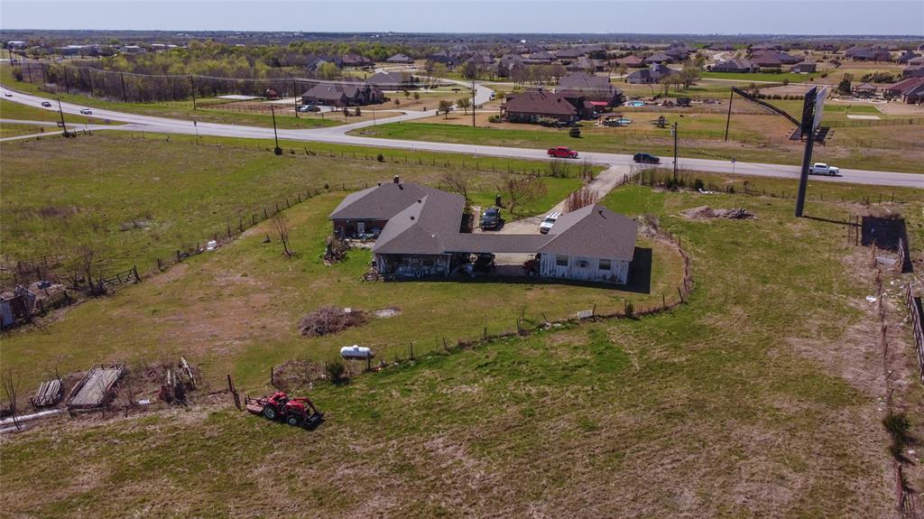 Listed at just under $17 per square foot, this property is located in the path of the upcoming Outer Loop, this combined 6.84-acre tract offers exceptional potential for future commercial development in one of Rockwall County’s fastest-growing corridors. With approximately 620 feet of frontage on SH 205, the property provides strong visibility and access, making it well suited for retail, office, service, or mixed-use development. Utilities are available, and planned transportation improvements are expected to significantly enhance accessibility and long-term value. The value of this property is in the land, not the existing improvement. Property also includes a land lease for an on-site billboard, providing additional income potential. Ideal opportunity for investors, developers, or end users looking for a strategic location in the path of future growth. Rare opportunity to secure acreage in a high-growth area with strong commercial potential.