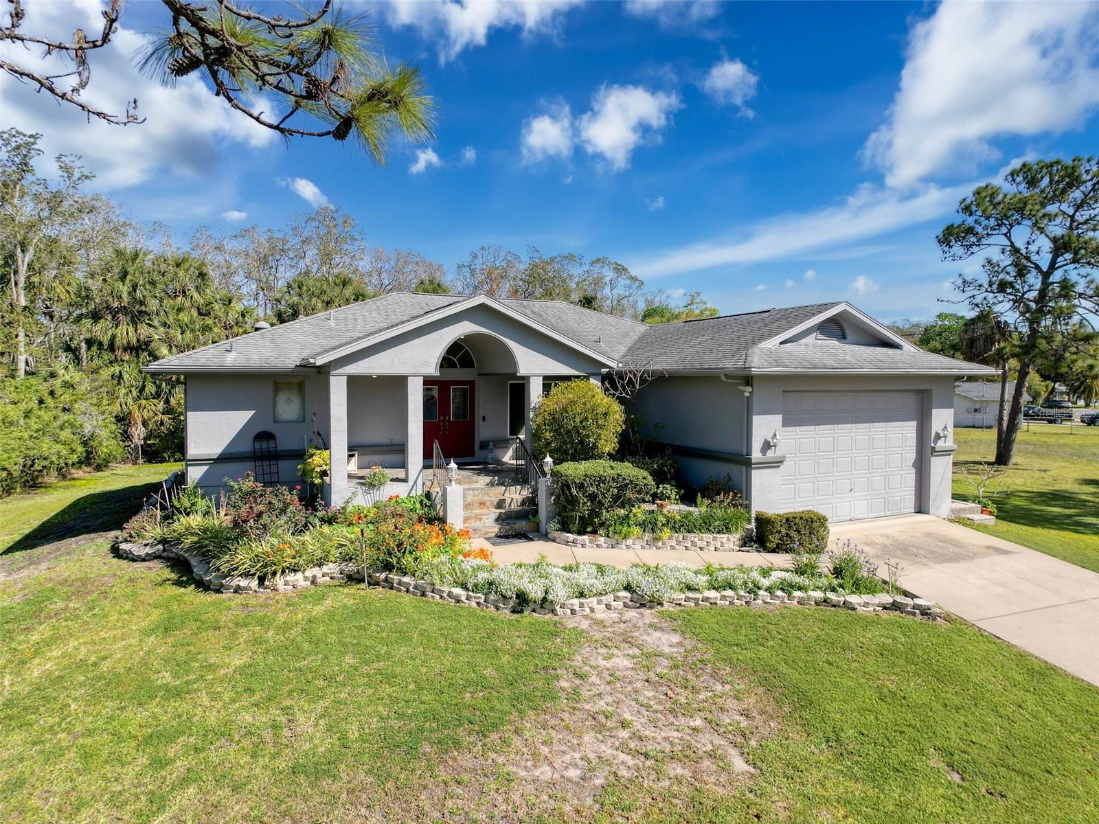 Back on the market with a new price adjustment! Welcome to this beautifully updated home in the desirable Sea Pines community. Originally built in 1991, this property has been extensively renovated and is truly move-in ready. Step inside to a warm and inviting living space featuring pocket sliding doors that open wide to showcase expansive backyard views and create seamless indoor-outdoor living. The fully remodeled primary bath offers a spa-like retreat with a jetted tub (with built-in heater), rich oak cabinetry, and granite countertops. The spacious kitchen is designed for both everyday living and entertaining, complete with abundant real oak cabinetry and generous counter space. Plus, there is an option to purchase two adjoining vacant lots for even more possibilities MLS#TB8492321. Enjoy peace of mind with a roof replaced in 2010 and a transferable 50-year warranty. The serene setting features mature landscaping, garden areas, and tranquil views of community green space—perfect for relaxing evenings on the back deck. Sea Pines offers a charming coastal lifestyle with access to a private park for fishing and relaxation, along with a community boat ramp providing direct Gulf access.