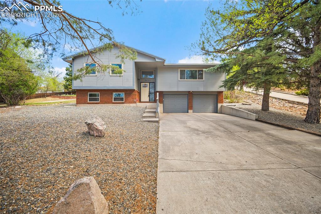 Welcome to  in the desirable Rockrimmon neighborhood, where thoughtful updates, outdoor access, and everyday convenience come together.This beautifully maintained 4-bedroom, 3-bath home offers a fully updated kitchen designed for both function and style, featuring modern finishes, ample workspace, and a layout that flows seamlessly into the main living areas. Whether you're hosting or enjoying a quiet evening at home, the space feels inviting, comfortable, and move-in ready.Step outside to a turfed backyard, creating a clean, low-maintenance outdoor retreat perfect for entertaining, pets, or simply relaxing. The yard offers year-round usability without the upkeep.Location is another standout feature. The home sits just 0.3 miles from a nearby park, only 0.2 miles from a trailhead for easy access to hiking and outdoor recreation, and just a quick 3-minute drive to I-25, making commuting, dining, and shopping incredibly convenient.With its updated interior, usable outdoor space, and prime location in one of the area's most loved neighborhoods, this Rockrimmon home offers the ideal balance of comfort, lifestyle, and accessibility.