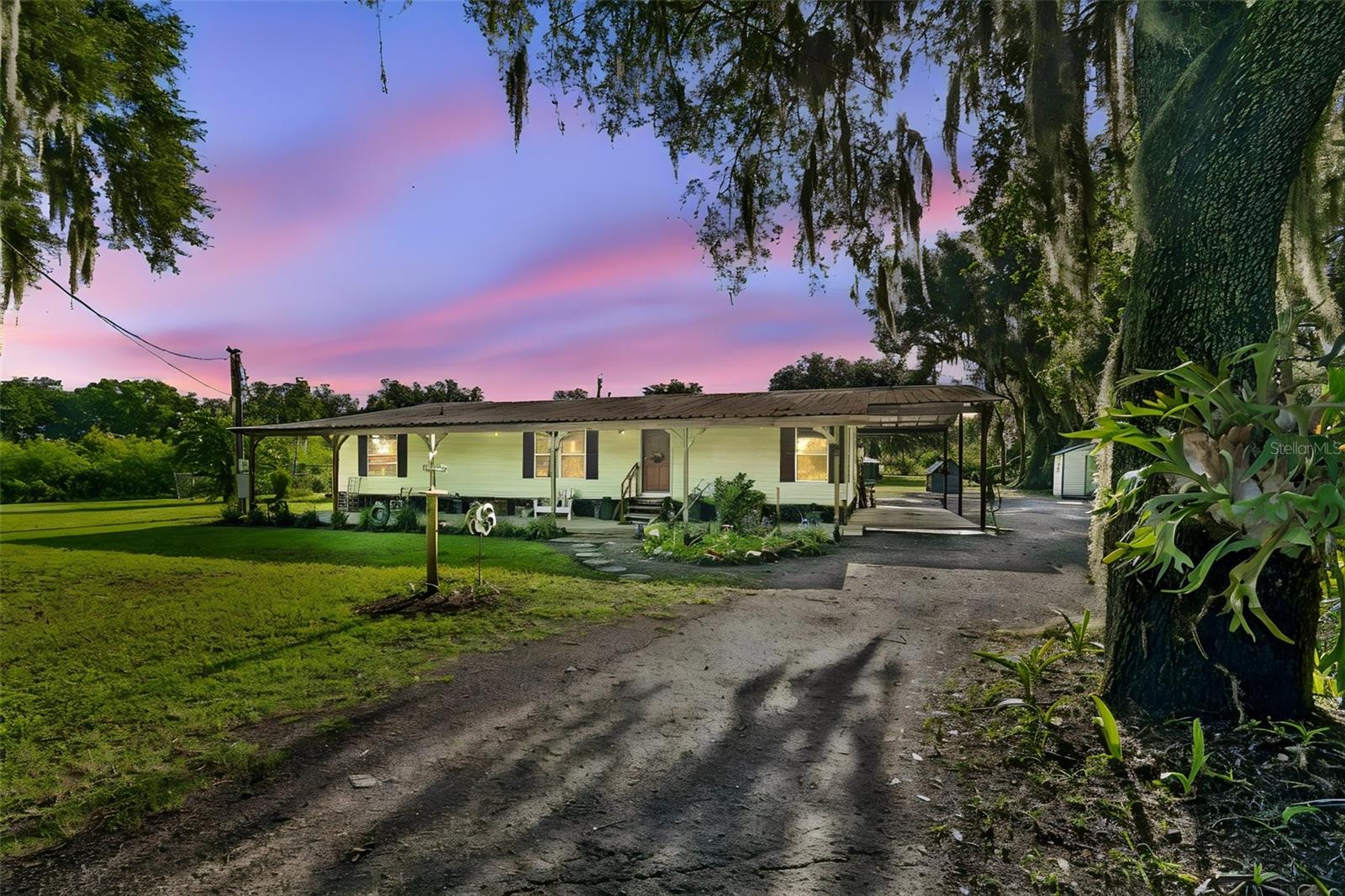Escape the hustle and bustle and enjoy the space, privacy, and peaceful surroundings of country living! Situated on 1.24 acres in Plant City, this 3-bedroom, 2-bathroom mobile home offers plenty of room to spread out, enjoy your outdoor hobbies, bring your recreational toys, and make the property your own—all with NO HOA restrictions!A covered front porch stretches the length of the home, creating the perfect spot to relax with your morning coffee, unwind at the end of the day, and enjoy the quiet country setting. Step inside to a warm and welcoming floor plan filled with natural light. The spacious living room provides plenty of room to gather, while the kitchen offers abundant cabinet and counter space for everyday cooking and entertaining. A separate dining room provides a dedicated space for meals with family and friends.All three bedrooms are comfortably sized, including a primary bedroom with a walk in closet. At the back of the home, a large screened porch expands your living space and provides another wonderful place to relax, entertain, or simply enjoy the outdoors while staying comfortably under cover.Outside is where this property really shines! With 1.24 acres, there is room to create the lifestyle you've been looking for. Plant a garden, add a workshop, create outdoor entertaining areas, make space for your RV, boat, or other toys, or simply enjoy having a large yard and plenty of breathing room. With no HOA restrictions, you'll have added flexibility to make the property work for your needs.Built in 1990 and ideally situated between Tampa and Lakeland, this property combines the privacy and charm of country living with convenient access to everyday necessities. Schools, shopping, dining, and major highways are nearby, while historic Downtown Plant City offers local restaurants, shops, coffee spots, and community events. Plant City is also home to the famous Florida Strawberry Festival and provides convenient access to I-4, Brandon, Lakeland, Tampa, and Central Florida attractions.If you've been searching for a property with acreage, privacy, outdoor space, and the freedom of NO HOA, this Plant City home offers a wonderful opportunity to enjoy a quieter lifestyle without giving up convenient access to everything you need.