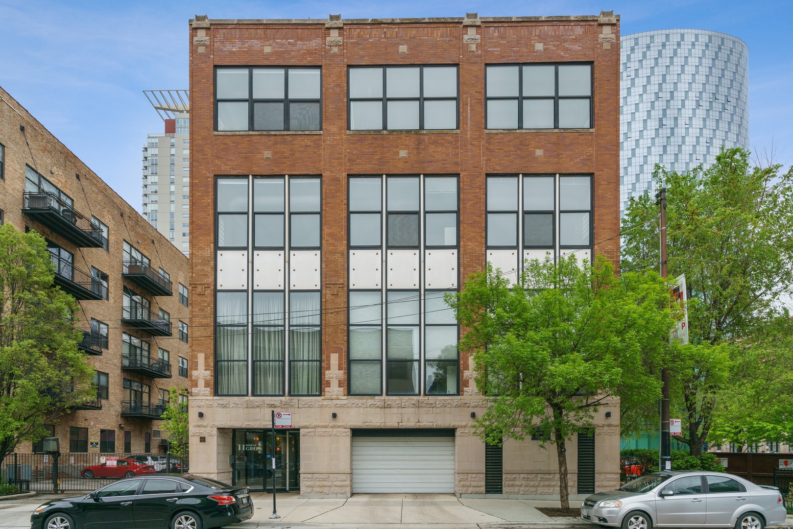 Stylish 3BR/3BA loft in boutique elevator building located in the heart of West Loop and Skinner School District. This amazing 2,100sf timber loft with exposed brick was newly renovated and features two levels of living space, soaring 20 foot ceilings, near floor-to-ceiling windows with extraordinary natural sunlight throughout. Brand new kitchen features new shaker style cabinetry, matte black faucet and pulls, stainless steel appliances, and quartz countertops. Massive living/dining room with newly refinished hardwood flooring and wood burning fireplace. Huge primary bedroom with soaring ceilings, large walk-in closet with custom organizers, & en-suite fully remodeled bathroom featuring chic greige vanity and quartzite countertops. 2nd bedroom on main level with full bathroom newly remodeled just across the hall. Lofted 3rd bedroom on 2nd floor with additional full bathroom. In-unit washer/dryer, private oversized storage in basement (18'x18'), common roof top deck with shared grills, 1 attached garage parking space included in the price. Ideally located just a quick stroll to Greek Town, Randolph St, Soho House, Whole Foods, Target, Marianos etc with easy access to CTA Blue Line, Metra and all major highways. Enjoy the convenient lifestyle of this highly sought after vibrant neighborhood in the heart of the West Loop with some of the best nightlife and dining this city has to offer!
