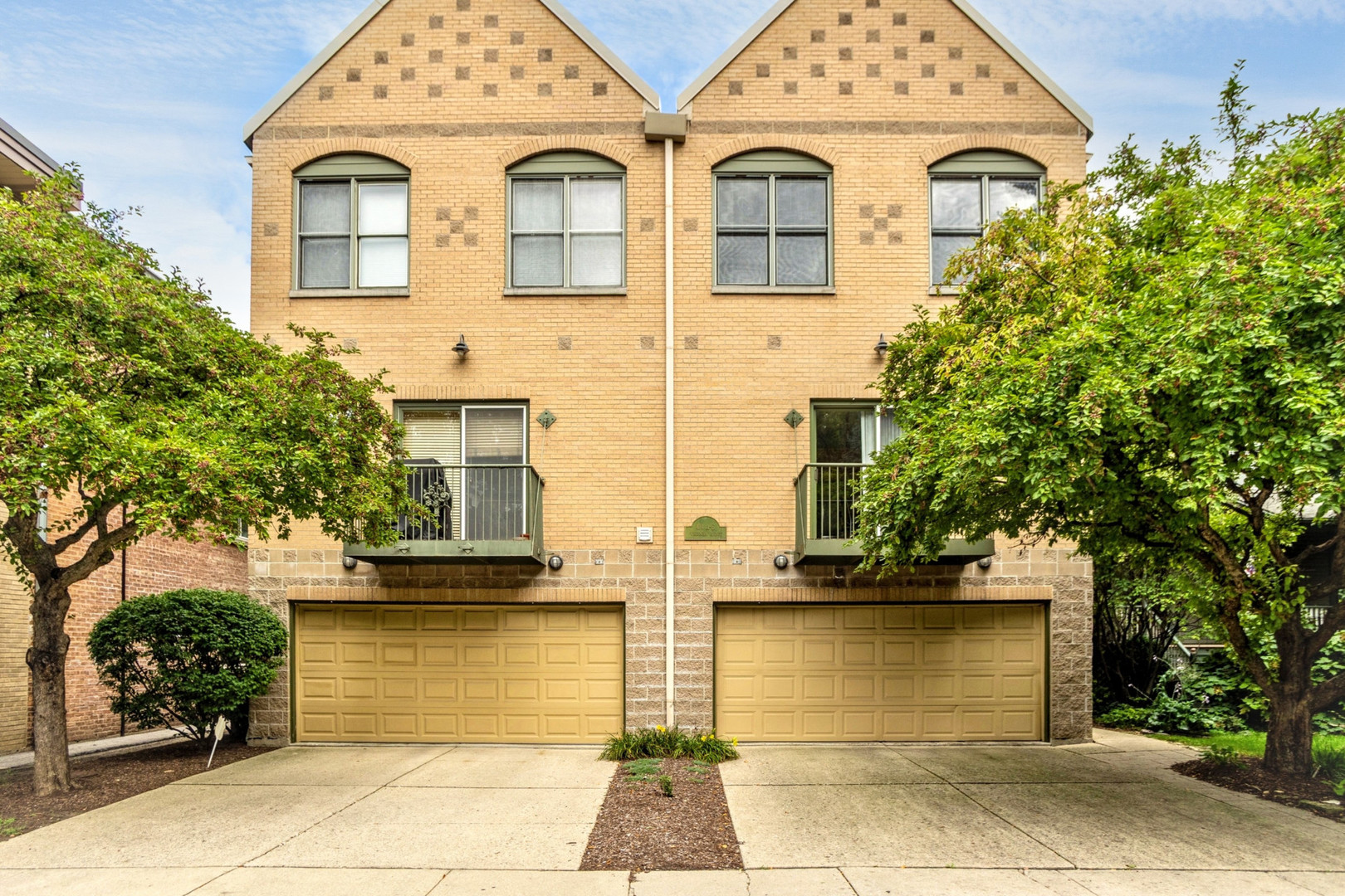 Welcome to an extraordinary gem in the heart of Oak Park!  Beautiful, large 3 bedroom end unit townhome with 2 full bathrooms and 2 half bathrooms, and 3 enviable levels of optimal space. The first floor can be utilized as a family room or a den and features a powder room and access to the 2 car garage. The second floor consists of a spacious living room and dining room combination with a big bay window that overlooks the lovely courtyard. Adjacent to the dining room is a fabulous kitchen with stainless steel appliances, miles of quartz counter space, oak cabinets, an island with seating for 3, a powder room. And sliding glass doors that open to a quaint balcony where you can enjoy a glass of wine or your morning coffee. Retreat to the 3rd floor where your primary suite awaits, complete with an en-suite bathroom, soaring ceilings and a large walk-in closet. Conveniently located down the hall are 2 additional bedrooms, and a full bathroom, adding ease and functionality to the layout! Adding to the appeal are hardwood floors throughout the 2nd floor, bathrooms on every level, 2nd floor washer/dryer, tons of natural light, and a wonderful outdoor common area. This prime location is truly unbeatable -  2 1/2 blocks to downtown Oak Park!  Close to restaurants, shops, parks, library, trains and highway access!