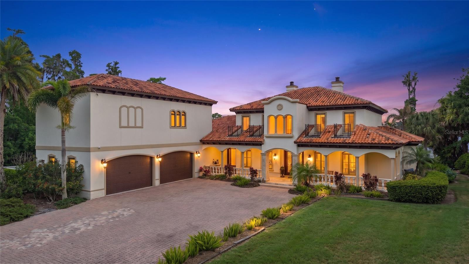 Under contract-accepting backup offers. Extraordinary gated lakefront estate situated on nearly 9 private acres on ski-sized Lake Brant. This one-of-a-kind Mediterranean-inspired waterfront compound offers unmatched privacy, breathtaking water views, and resort-style living in one of Lutz’s most exclusive settings. The residence features expansive living spaces, soaring ceilings, a gourmet chef’s kitchen, spacious bedrooms, and seamless indoor-outdoor living designed for luxury entertaining. Outdoor amenities include a spectacular resort-style pool and spa, private US Open-style tennis court, boat house, dock, and expansive entertaining areas overlooking the lake. Surrounded by lush landscaping and mature trees, this exceptional property creates a private retreat while remaining just minutes from Tampa, top-rated schools, shopping, dining, golf, and major highways. A rare opportunity to own one of the Tampa Bay area’s most exclusive lakefront estates combining luxury, acreage, lifestyle, and privacy in an unmatched setting.