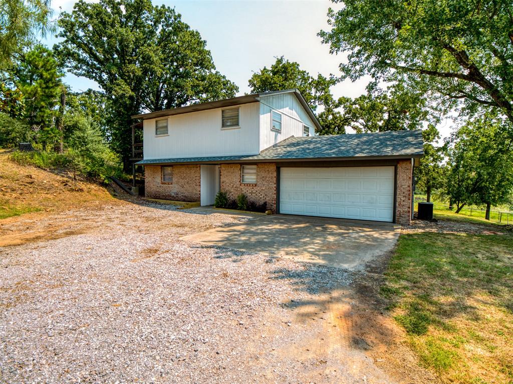 Country living on 5 acres. Newly updated home with 3 bedrooms and 2 full bathrooms. Home has new roof July 2025, granite counter tops, tile floors, tile back splash, lvp flooring upstairs, the entire home has been painted inside, interior doors with new hardware. The bathroom upstairs has new countertop with sink and new tile in the shower. New shower tile in downstairs bathroom. Fully fenced and ready for your animals. Lots of deer,  turkey and other wild life. Please make your appointment today...dont want to miss this one.