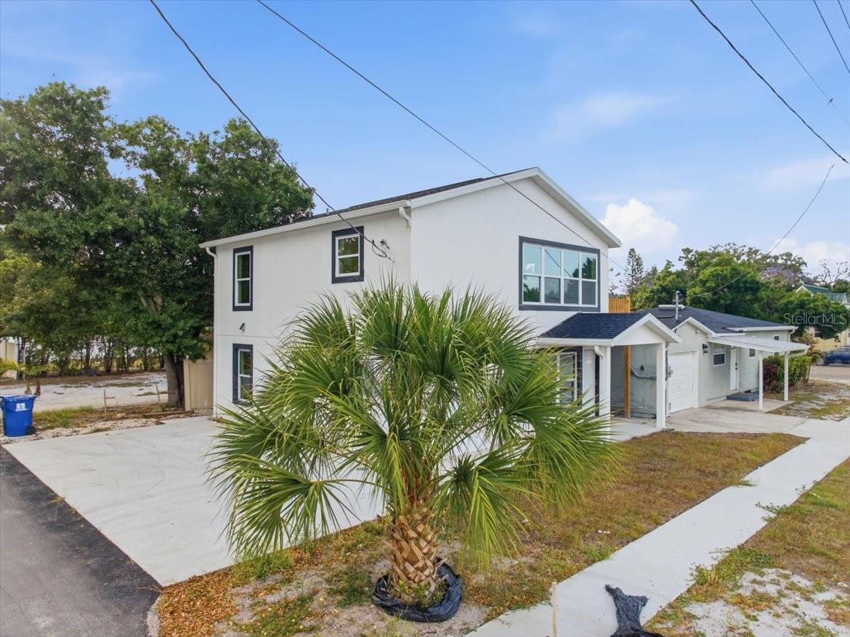 3 HOMES IN ONE! True MULTI GENERATIONAL LIVING OR a PERFECT CASH FLOWING INVESTMENT TRIPLEX! HOUSE HACK and LIVE IN the front home while renting out the HUGE, BRAND NEW CONSTRUCTION DUPLEX in the rear! Welcome to this charming home in the heart of St. Petersburg, FL! Nestled in the peaceful, cozy neighborhood of Disston Heights, this COMPOUND dons a spacious 3-bedroom 2-bathroom home and a HUGE duplex with 2 bedroom, 1 bathroom units! These homes boast lovely natural lighting! The interiors are thoughtfully designed, featuring a fully equipped kitchen, cozy living areas. This home's location is unbeatable, situated in a vibrant neighborhood close to schools, parks, shopping, and dining-all within easy reach. Immerse yourself in the local charm of St. Petersburg! Located just 12 minutes from the BEACH and just 10 to Downtown, you are literally just minutes away from the city's vibrant energy where you'll love to explore local attractions, bars, and restaurants, then return to relax in your income producing haven! Schedule TODAY this will sell FAST!