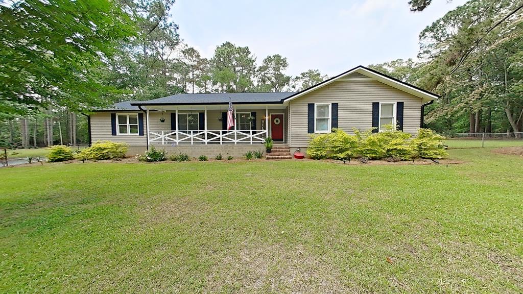 This well-kept home offers three bedrooms and two bathrooms on a private lot at the end of a cul-de-sac. Lot size spans over one and a half acres. A spacious foyer welcomes you into a large living room and dining room.  French doors open to a substantial screened porch that overlooks an expansive, fenced backyard. Additional highlights include a large workshop with electricity and water, an inground pool with a charming pool house with covered porch and full bath, plus the privacy and seclusion of a fully fenced property. Home office is perfect for today's flexible living. The kitchen features abundant cabinet space and flows into a breakfast area and walk in laundry room. Conveniently located near schools and shopping, this home presents a fantastic opportunity to own a well-maintained residence in a desirable setting.