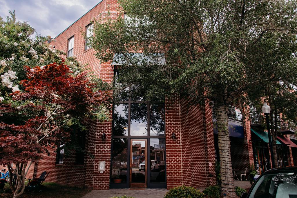 Enjoy breathtaking sunsets and sweeping views of the Cape Charles marina and the Chesapeake Bay from your private balcony in this charming third floor studio. Located on the top floor with no units above, you'll appreciate the added peace and quiet. Accessible by both elevator and stairwell, this bright and airy unit features beautifully refinished hardwood floors, a tiled shower, and a convenient laundry room with a stackable washer and dryer. Two dedicated parking spaces are included for added ease and convenience. Situated in the heart of town, you're just steps away from the Cape Charles public beach, boutique shops, restaurants, ice cream parlors, a local distillery and brewery, and summer concerts in the park. This unit is ideal as a personal getaway, or year round coastal living!