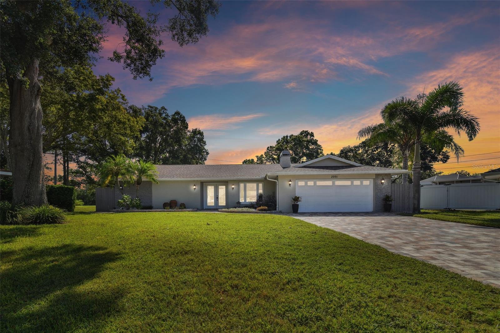 GOLF COURSE VIEWS, NO REAR NEIGHBORS, YOUR OWN PRIVATE POOL and ON A CUL-DE-SAC —welcome to Florida living at 2991 Heather Trail! Located in Clearwater’s Countryside area, this single-story, 4-bedroom, 2.5-bath home brings together a scenic setting, inviting outdoor space, and convenient access to everyday essentials.The remodeled kitchen and bathrooms, recessed LED lighting, and extended paver driveway and walkway complement the home’s welcoming appeal. A Heritage shingle roof installed in 2019 adds to its list of improvements, which also includes exterior painting, pool resurfacing, and rescreening of the pool enclosure.Enjoy morning coffee overlooking the golf course, spend sunny afternoons by the pool, or gather with friends for a relaxed evening outdoors. The screened pool area and open views create a wonderful backdrop for entertaining or simply unwinding at home.Nearby shopping and dining, including Northwood Plaza, make everyday outings convenient, while area golf courses and parks offer plenty of ways to enjoy the outdoors. With Philippe Park and John Chesnut Sr. Park within an easy drive, there is more to explore beyond your own backyard.Whether you’re drawn to the single-story design, the poolside lifestyle, or the golf course setting, this home offers a compelling combination of comfort and location. Schedule your private showing and experience it for yourself!