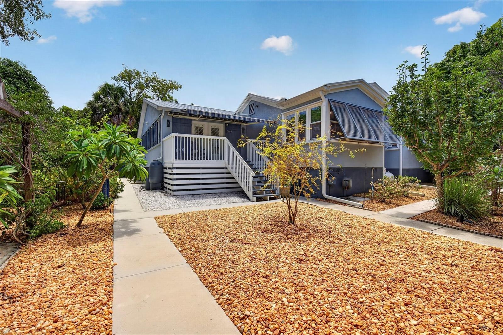 Turnkey Move-In Ready | Custom Elevated Home on 0.59 Acres – No Flood Zone, No HOAThis stunning, fully updated custom-built home sits on a beautifully landscaped corner lot with exceptional privacy and endless possibilities.  The original part of the house is a historic Florida farm cottage updated with an addition in 2004.  Completely remodeled and meticulously maintained, it offers a bright, airy open floor plan perfect for modern living and entertaining.The spacious great room features custom entertainment cabinetry and flows into a true gourmet kitchen boasting porcelain countertops, solid wood KraftMaid cabinets with soft-close pull-outs, premium stainless appliances including a Jenn-Air double oven, Thermador Professional gas range, LG dishwasher and LG French-door refrigerator. A separate living area with fireplace with electric heater insert makes an ideal den, office, or easy 4th bedroom conversion.The primary suite is a true retreat with a luxurious remodeled bath featuring a large walk-in shower and elegant claw-foot tub. A large laundry/utility room and abundant storage complete the thoughtful layout.Additional Upgrades Include: 50-year metal roof (2024). Built out the Guest Cottage (2024), Water Softener (2023), New Well Pump with whole-house water filtration, On Demand Gas Water Heater for Main House , Electric On Demand Water Heater for Cottage, 100 Gallon Propane tank just to name a few.Bonus Self-Sufficient CottageA fantastic porcelain-tiled guest/in-law suite with full kitchen, full bath with large walk-in shower — perfect for extended family, guests, or income production (currently counted as the 3rd bedroom and 3rd bath).Outdoor ParadiseEnjoy 15+ varieties of fruit trees (Mango, Avocado, Persian Lime, Meyer Lemon, and more), new sidewalks, an expanded carport, hurricane protection on all windows and a covered/screened outdoor living area ideal for private entertaining. This lush, low-maintenance .59-acre lot feels like your own private oasis. Worth noting the home received no damage from recent hurricanes Helene and MiltonPrime Palm Harbor LocationJust steps from the Pinellas Trail, in the highly rated Palm Harbor University school district, and a short drive to Tarpon Springs Sponge Docks, historic Dunedin, and world-class beaches at Honeymoon Island and Fred Howard Park.This rare combination of a fully updated custom home, income-producing cottage potential, abundant fruit trees, and prime location on a large private lot won’t last long. Check out the website. A true must-see for buyers seeking something truly special. Schedule your private showing today!